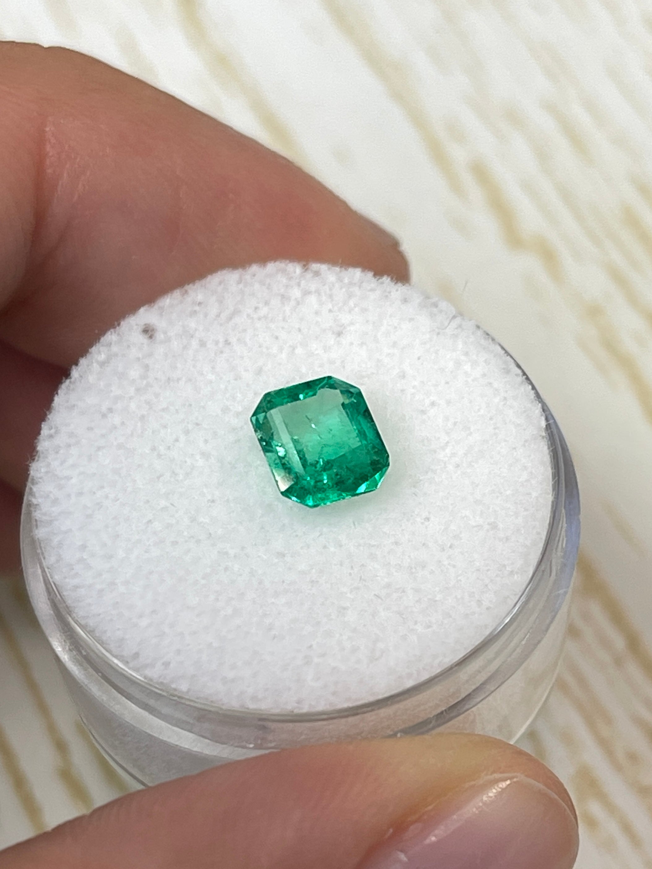 Loose 1.20 Carat Colombian Emerald in emerald cut, with yellowish-green natural hue, from JR Colombian Emeralds.