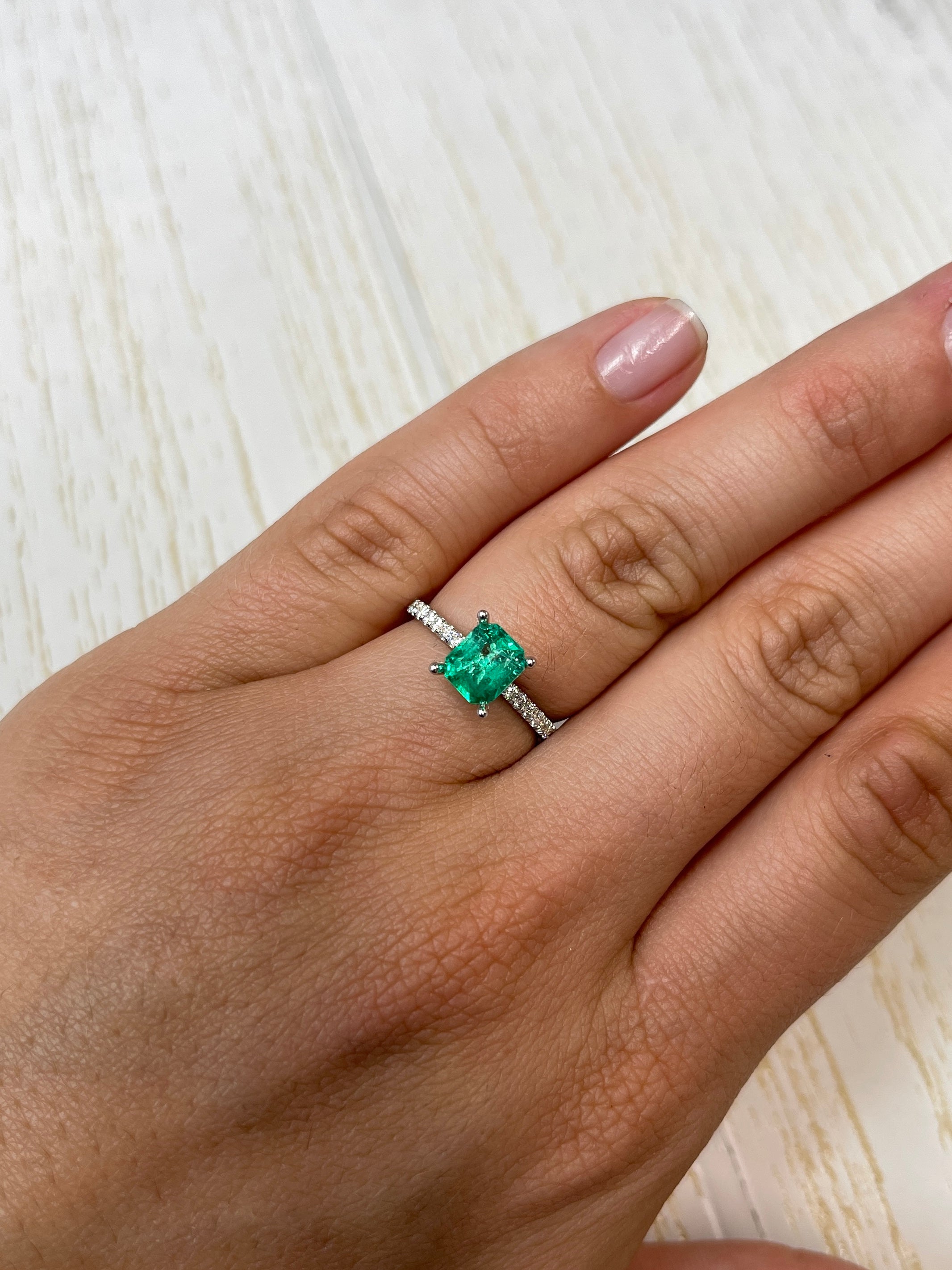 Natural 1.20 carat yellowish green Colombian emerald loose gemstone in emerald cut, from JR Colombian Emeralds.