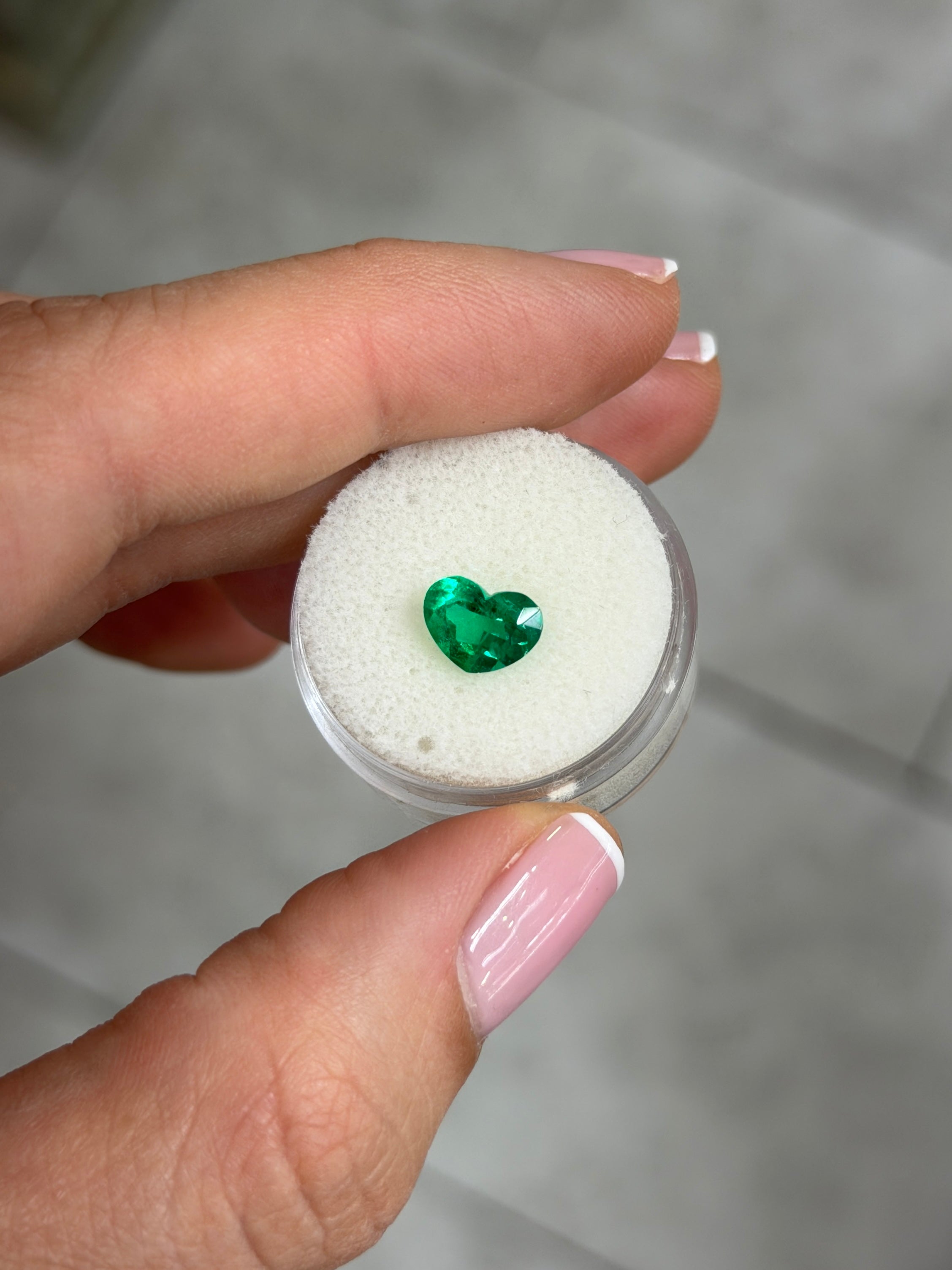 1.28 carat AAA+ vivid intense Muzo green Colombian emerald loose heart cut gemstone from JR Colombian Emeralds.