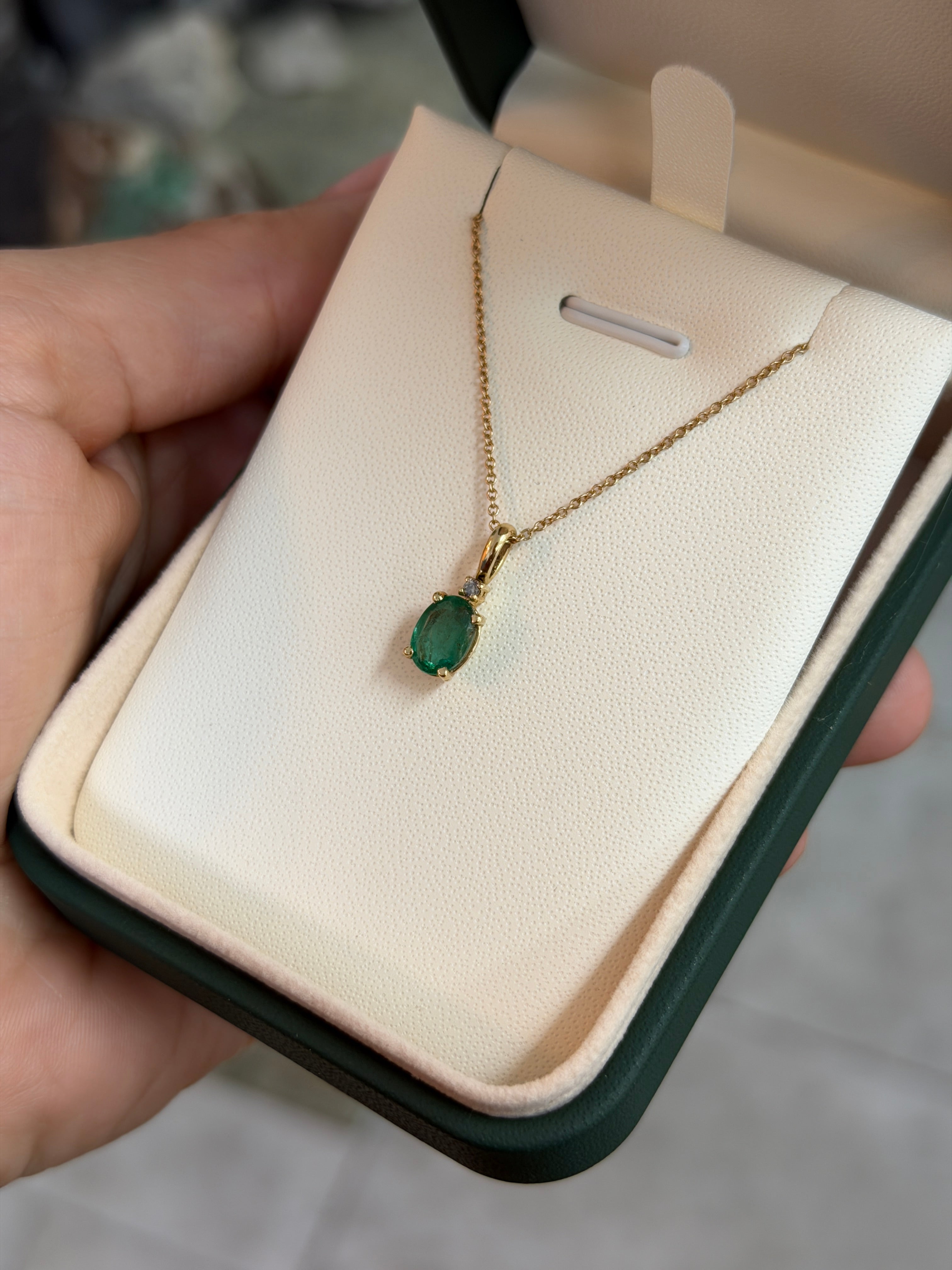 14K yellow gold pendant necklace with 1.30tcw oval cut natural emerald and diamond accents, by JR Colombian Emeralds.