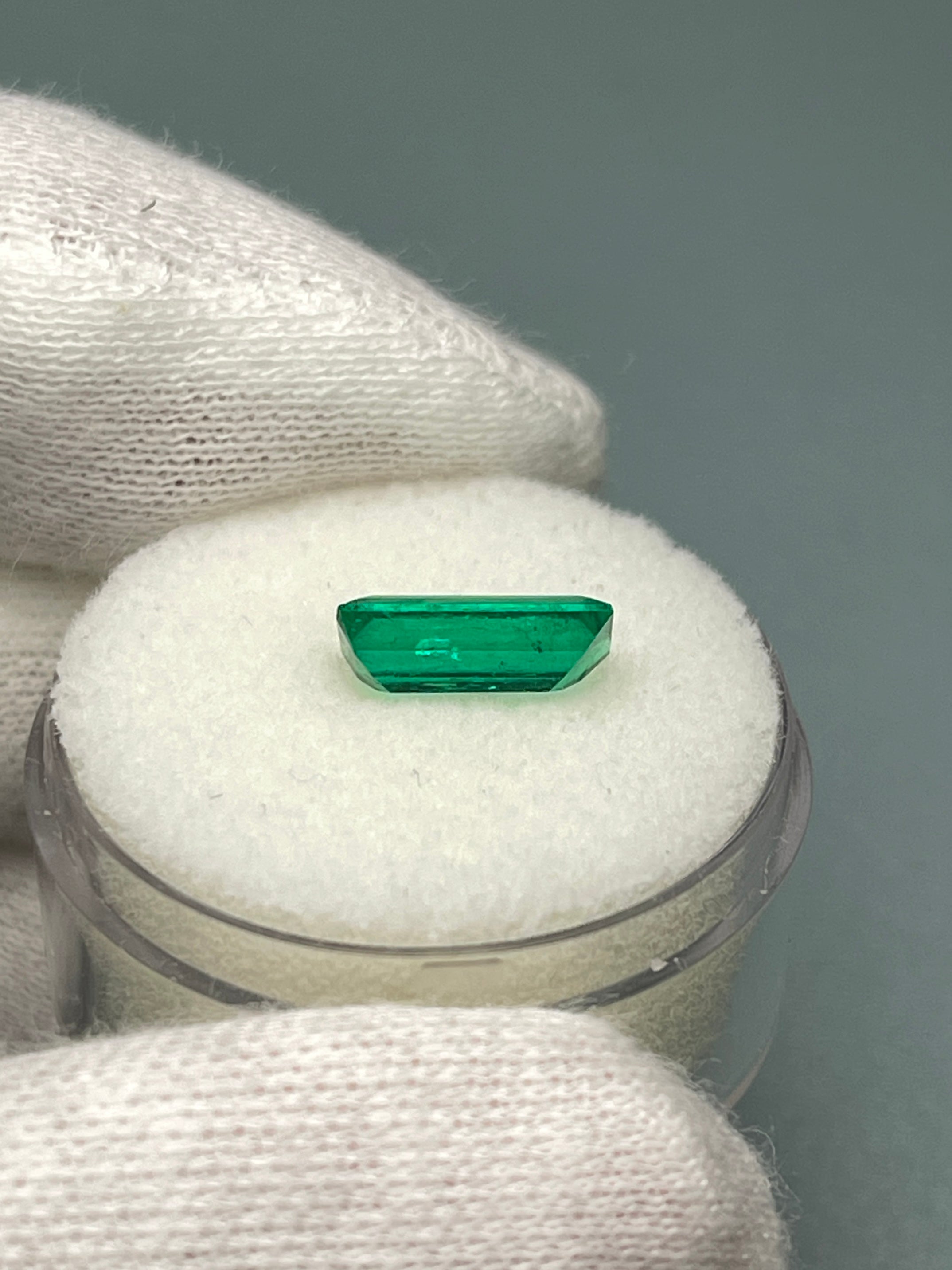 Natural 1.38 Carat AAA+ Muzo Colombian Emerald Baguette, loose gemstone with vibrant green color, from JR Colombian Emeralds.