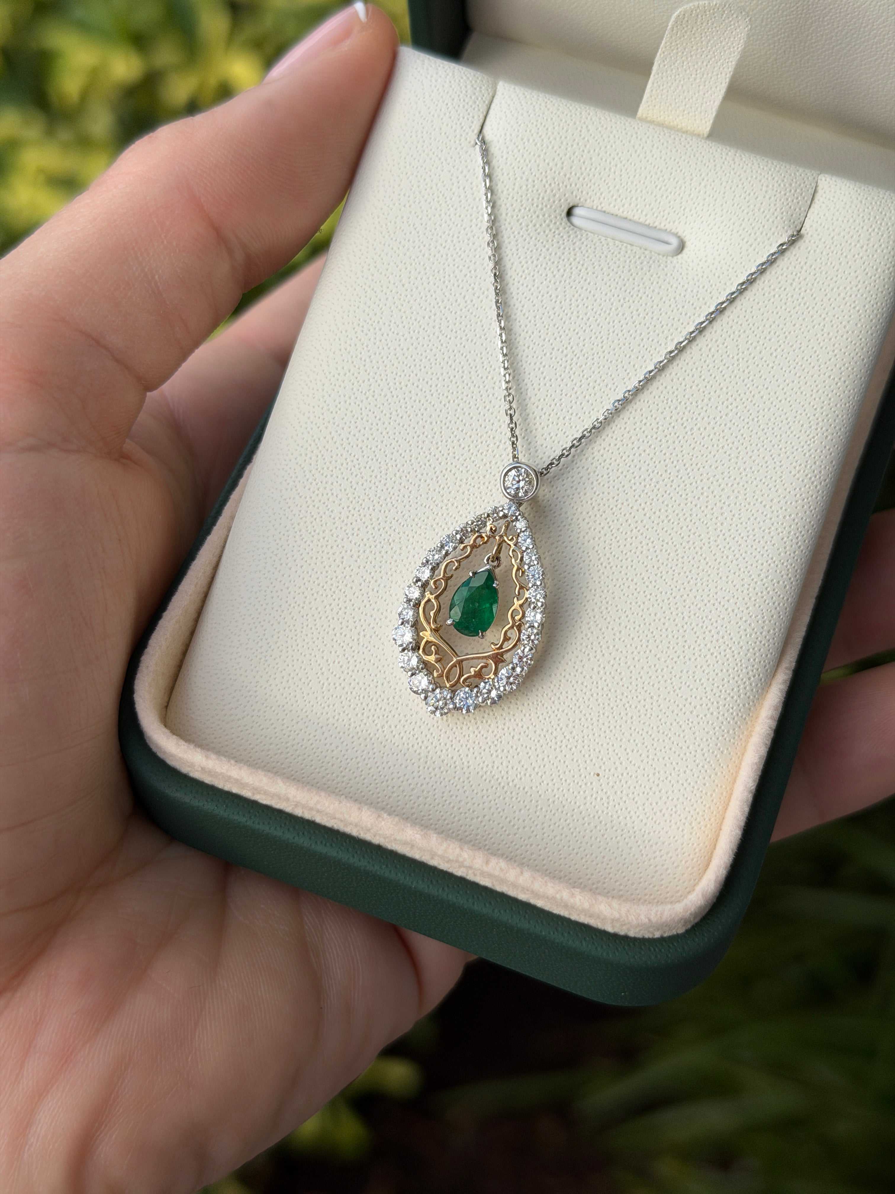 Pear-shaped emerald and diamond statement necklace in 14K two-tone gold, featuring 1.43 total carats from JR Colombian Emeralds.