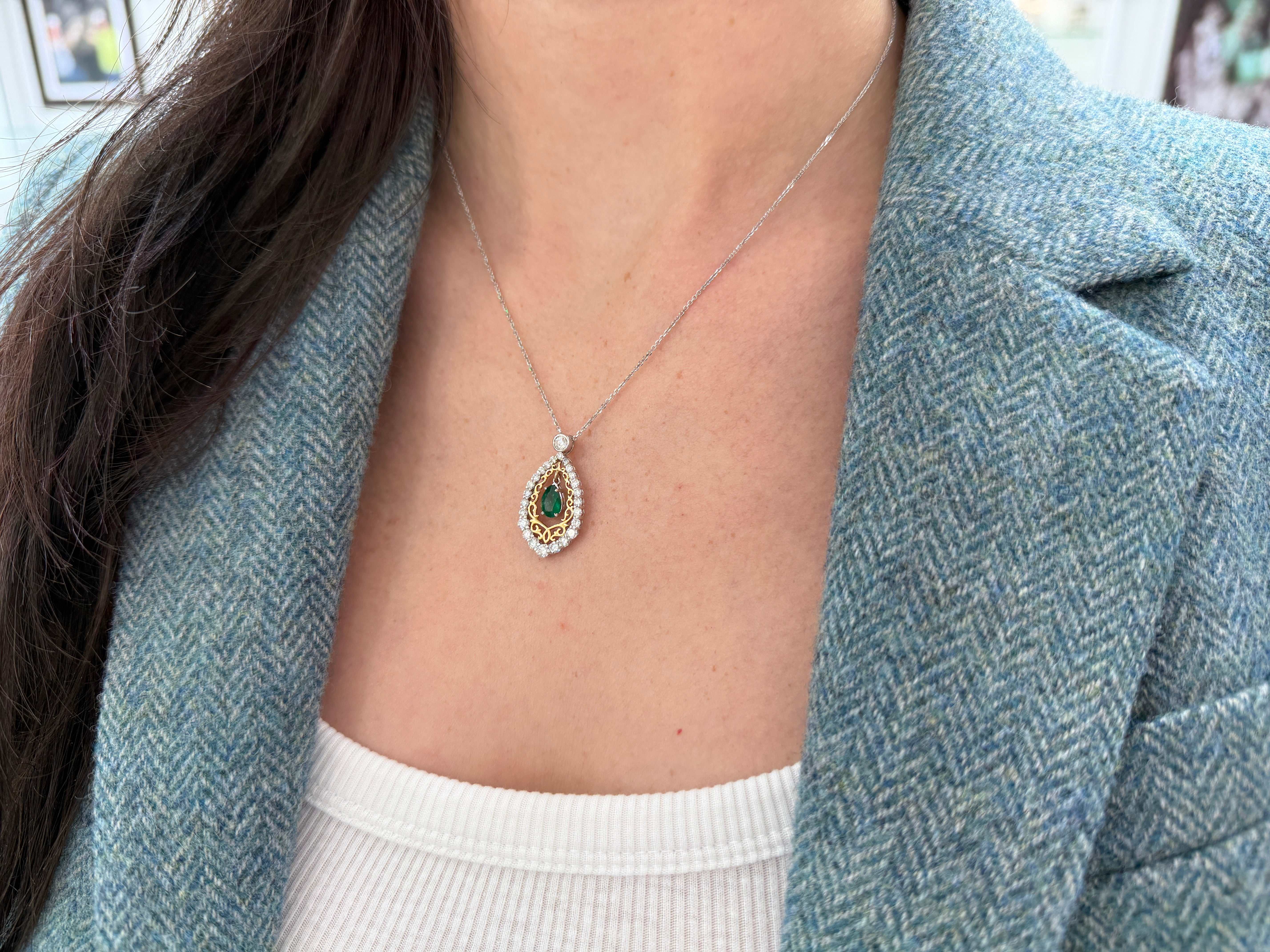 Pear-shaped emerald and diamond two-tone statement necklace in 14K gold by JR Colombian Emeralds, showcasing elegant jewelry design.