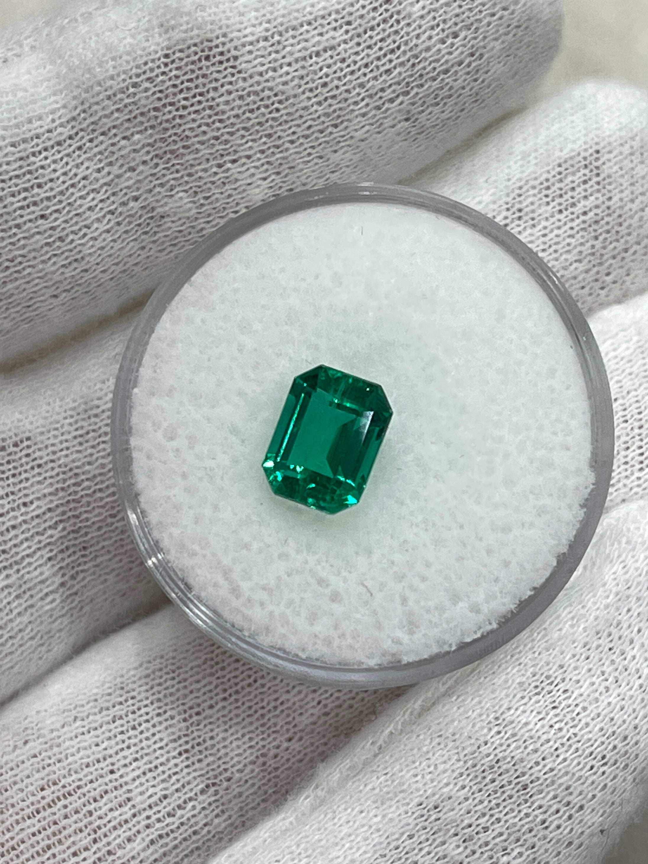 Vivid bluish-green 1.49 carat Colombian emerald cut gemstone from JR Colombian Emeralds, showcasing clarity and vibrant color.