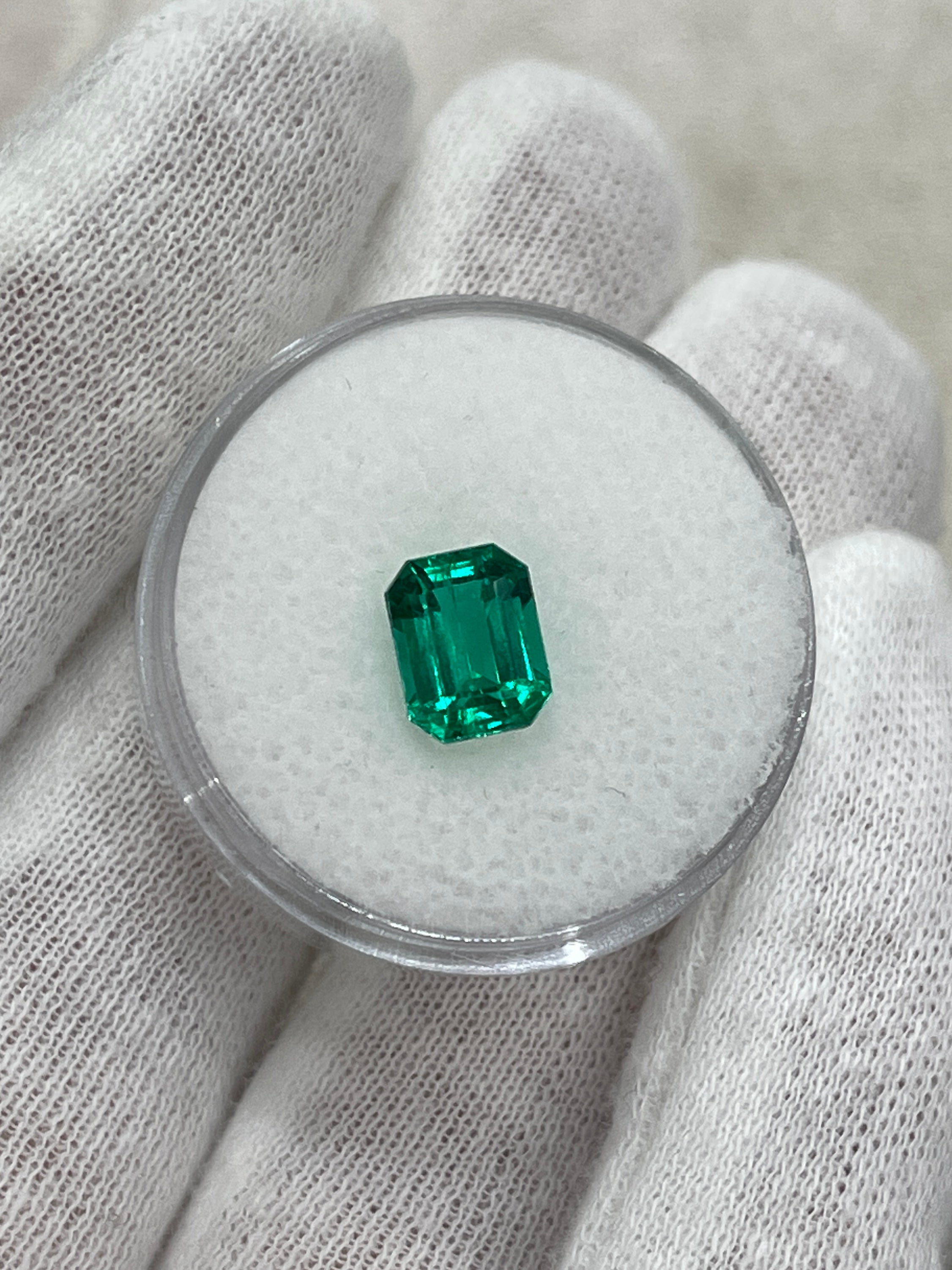 Vivid bluish green 1.49 carat Colombian emerald cut gemstone from JR Colombian Emeralds, showcasing clarity and vibrant color.
