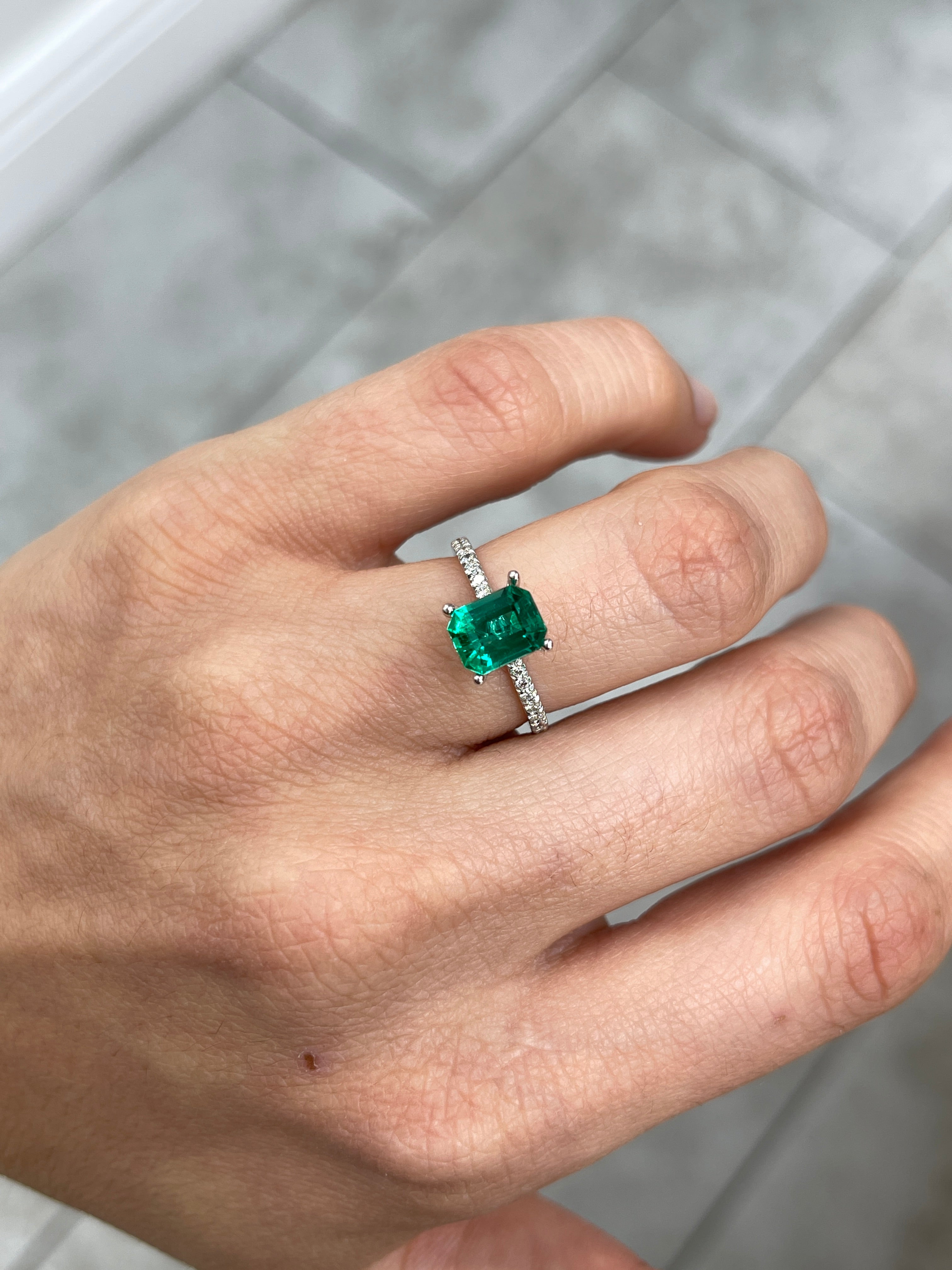 Vivid bluish green 1.49 carat Colombian emerald cut by JR Colombian Emeralds, showcasing its radiant clarity and classic shape.