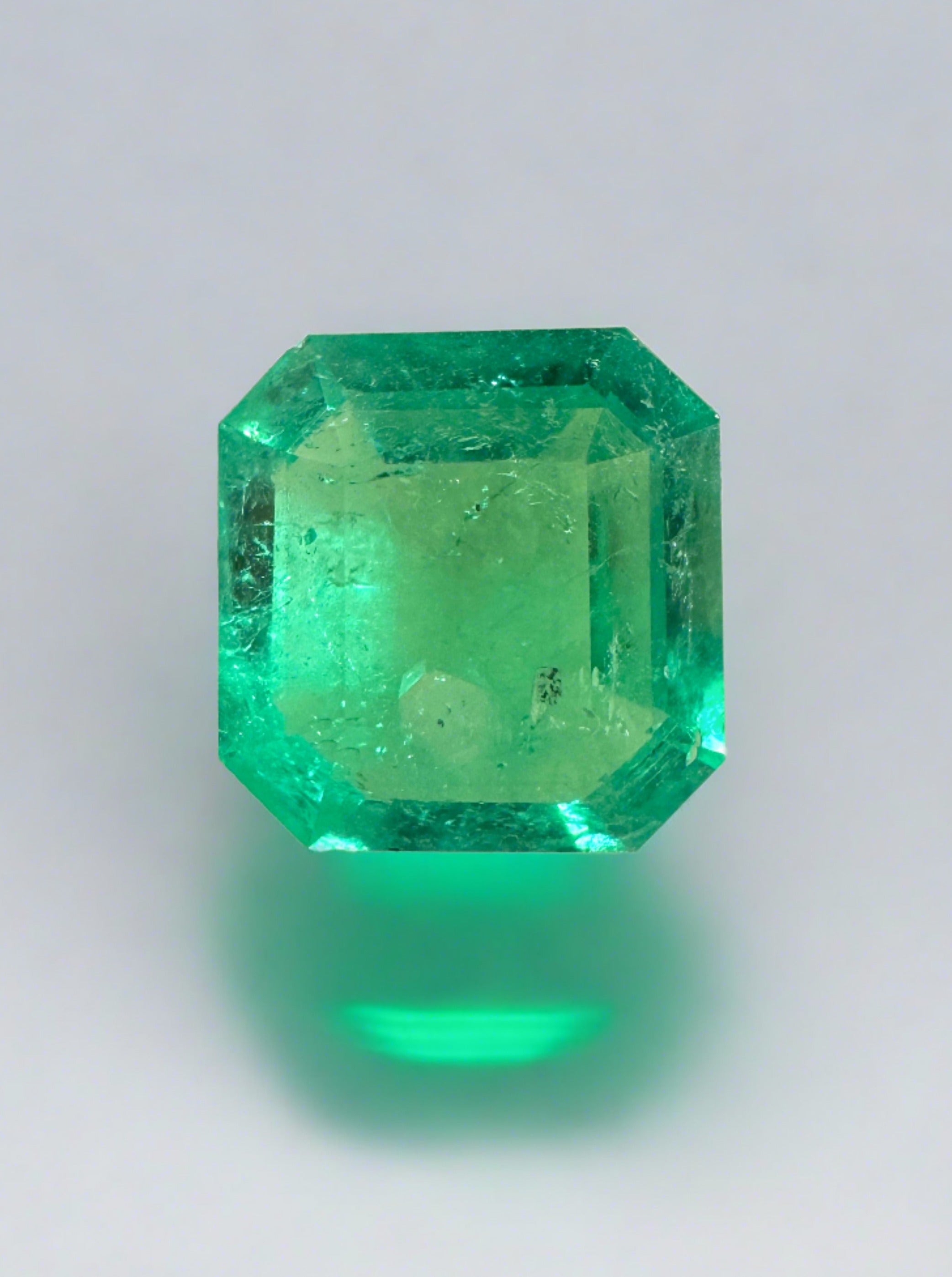 1.53 carat natural Colombian emerald loose gemstone, 8x8mm, yellowish green, cut, with a rare spready shape from JR Colombian Emeralds.