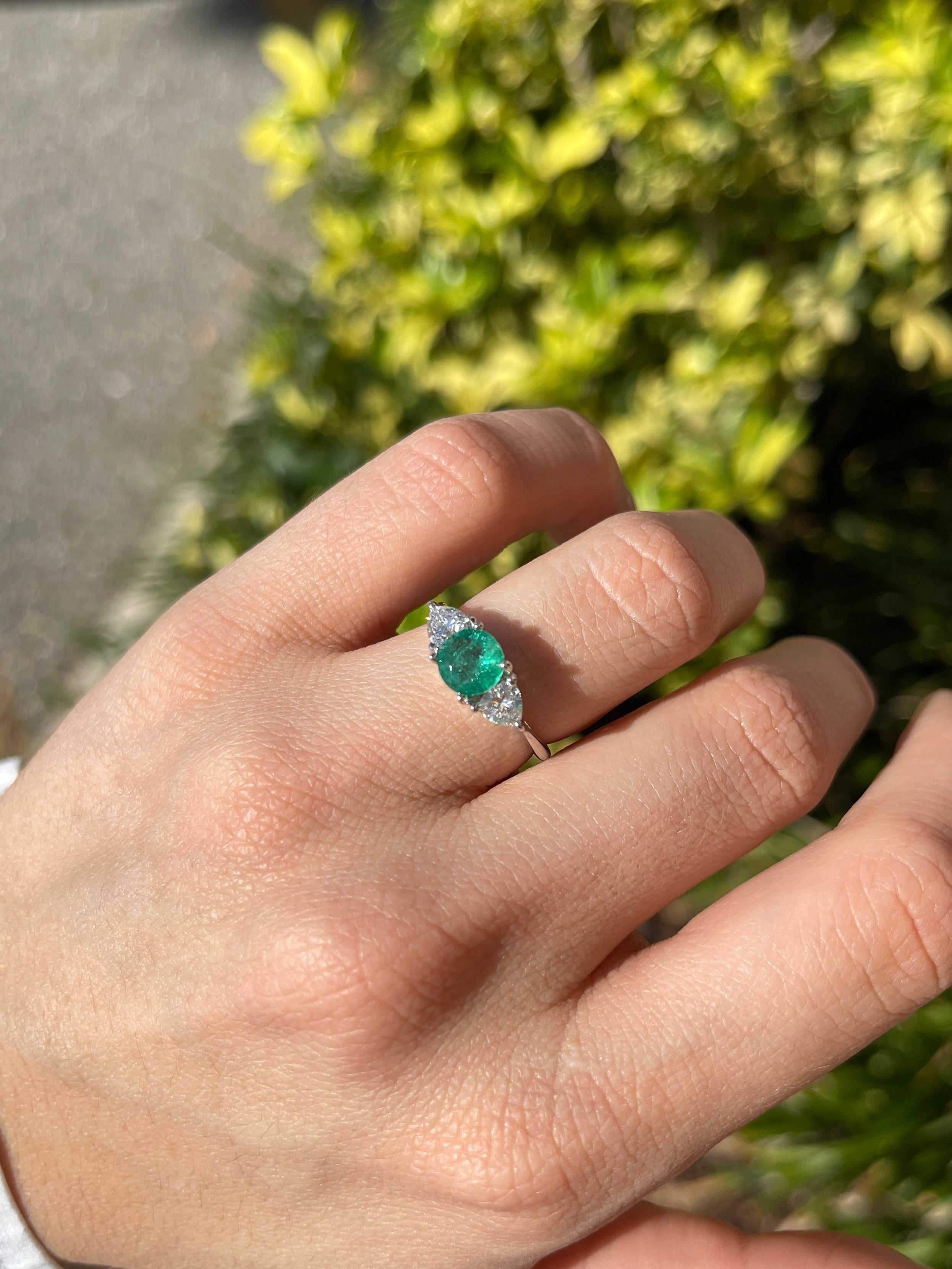 14K gold three stone ring with 1.55tcw natural round emerald and trillion lab diamond accents, crafted by JR Colombian Emeralds.