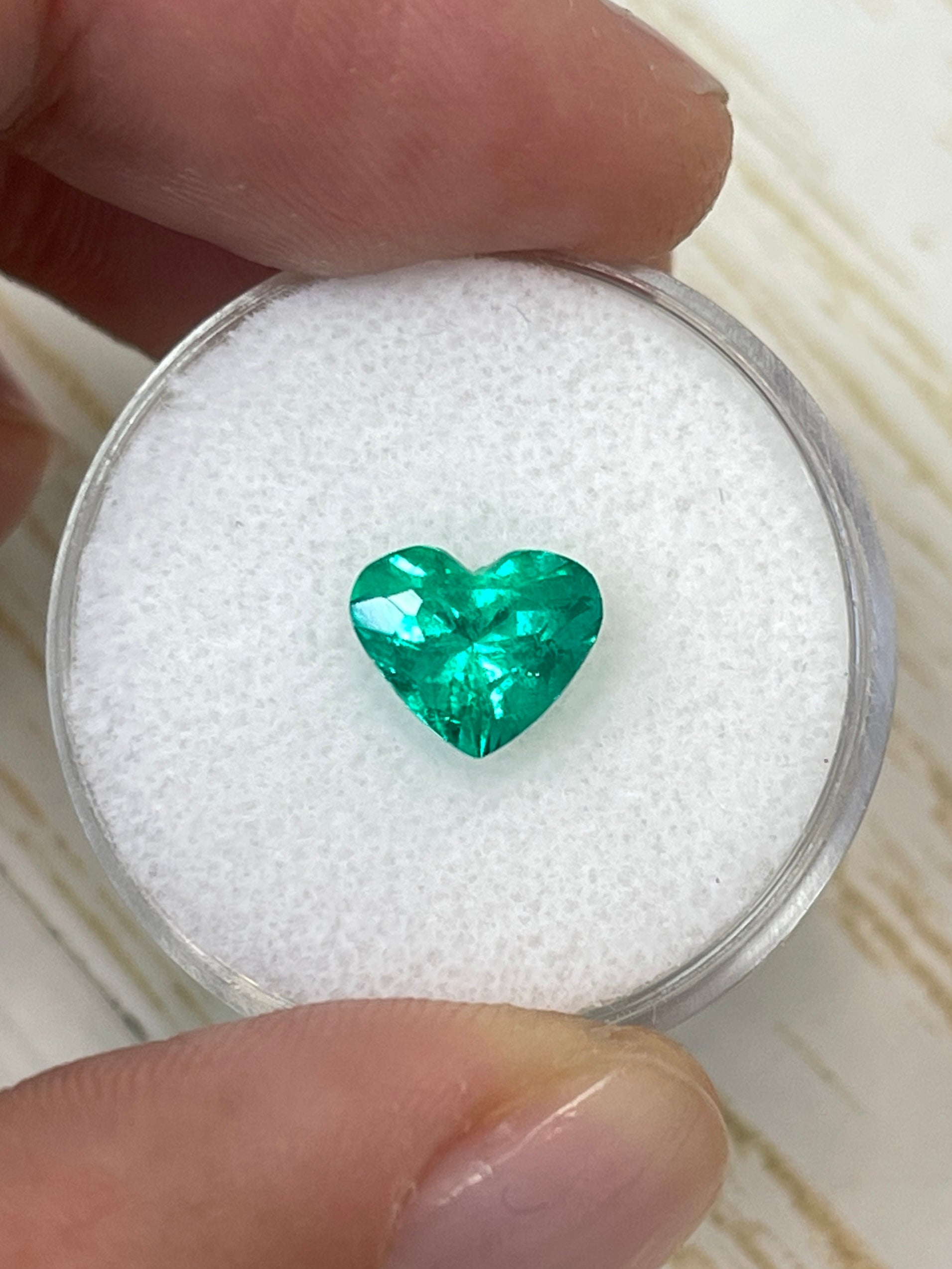 1.62 carat VS clarity green natural Colombian emerald heart-cut loose gemstone by JR Colombian Emeralds.