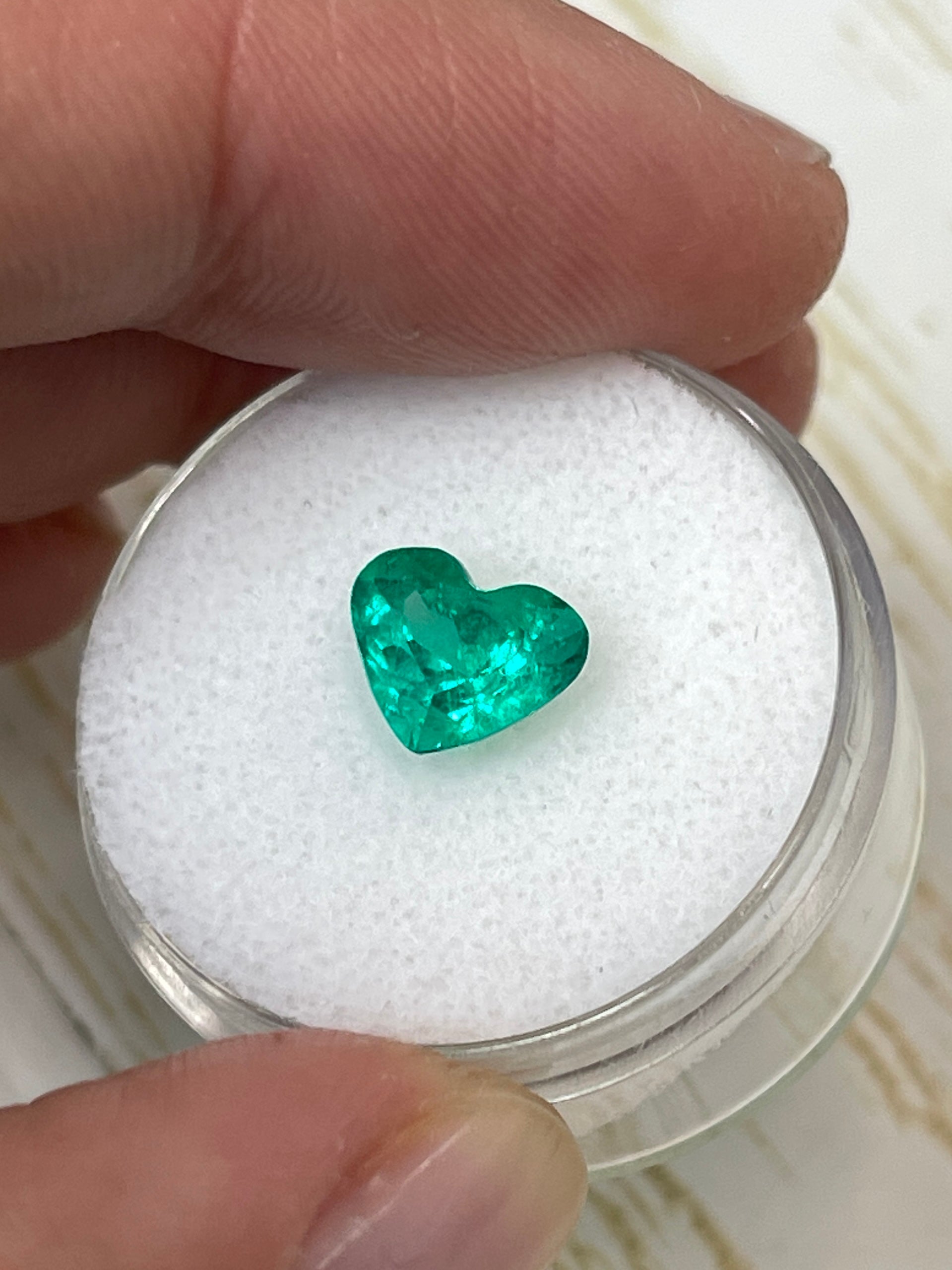 1.62 Carat VS clarity green natural Colombian emerald loose heart-shaped gemstone from JR Colombian Emeralds