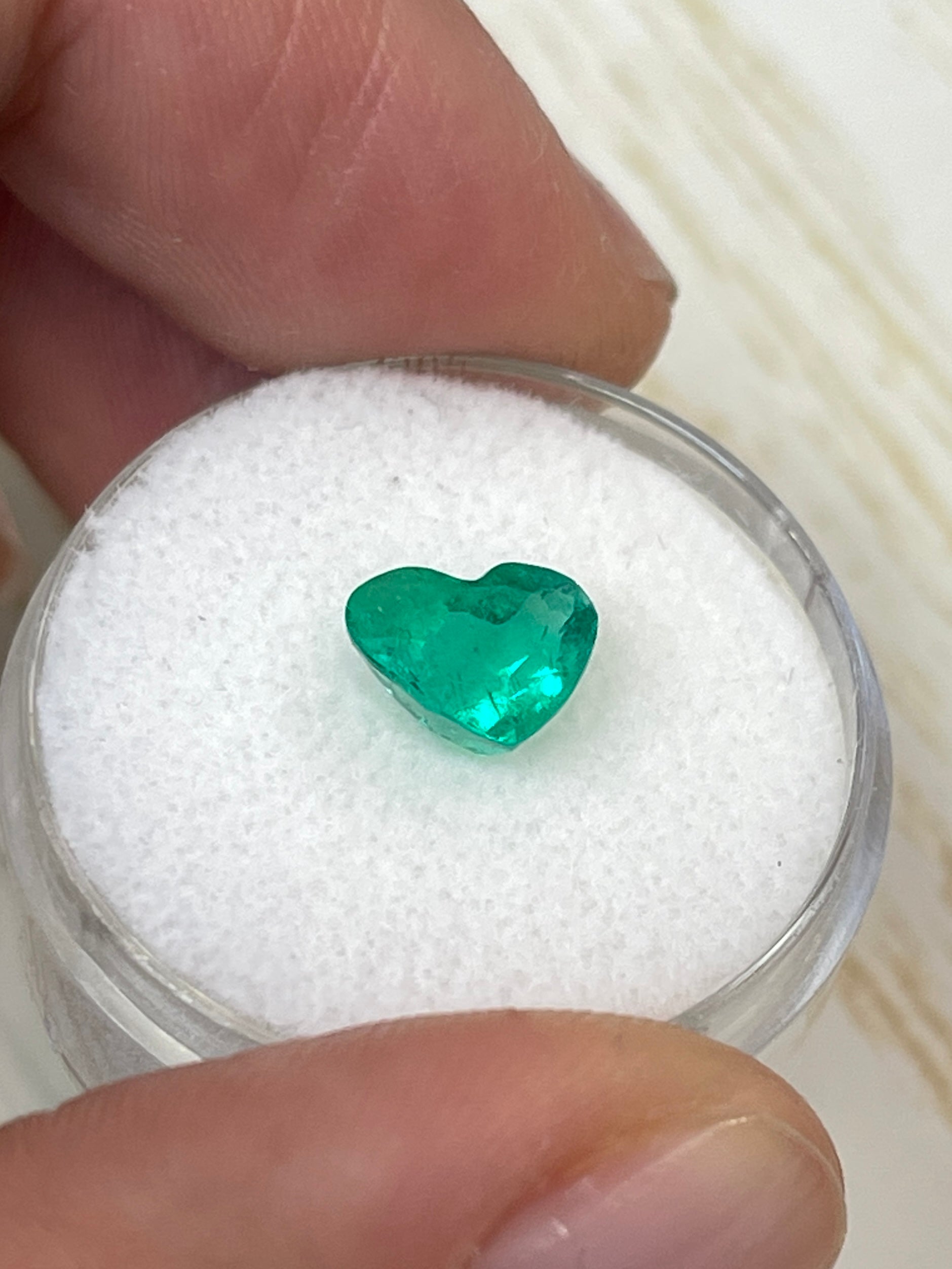1.62 carat VS clarity green Colombian emerald loose heart-shaped cut gemstone by JR Colombian Emeralds.
