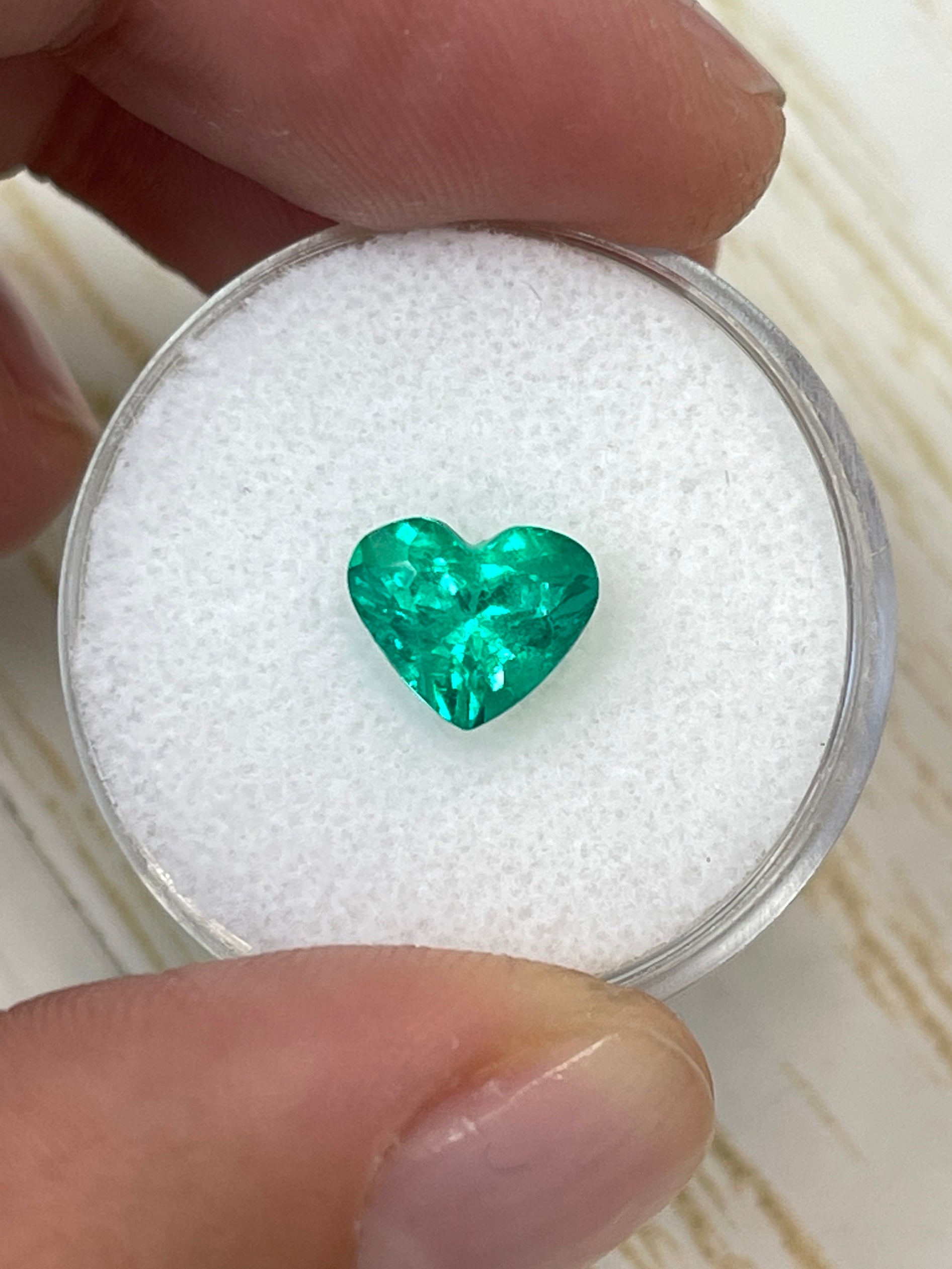 1.62 carat VS clarity green Colombian emerald loose heart-shaped cut gemstone by JR Colombian Emeralds