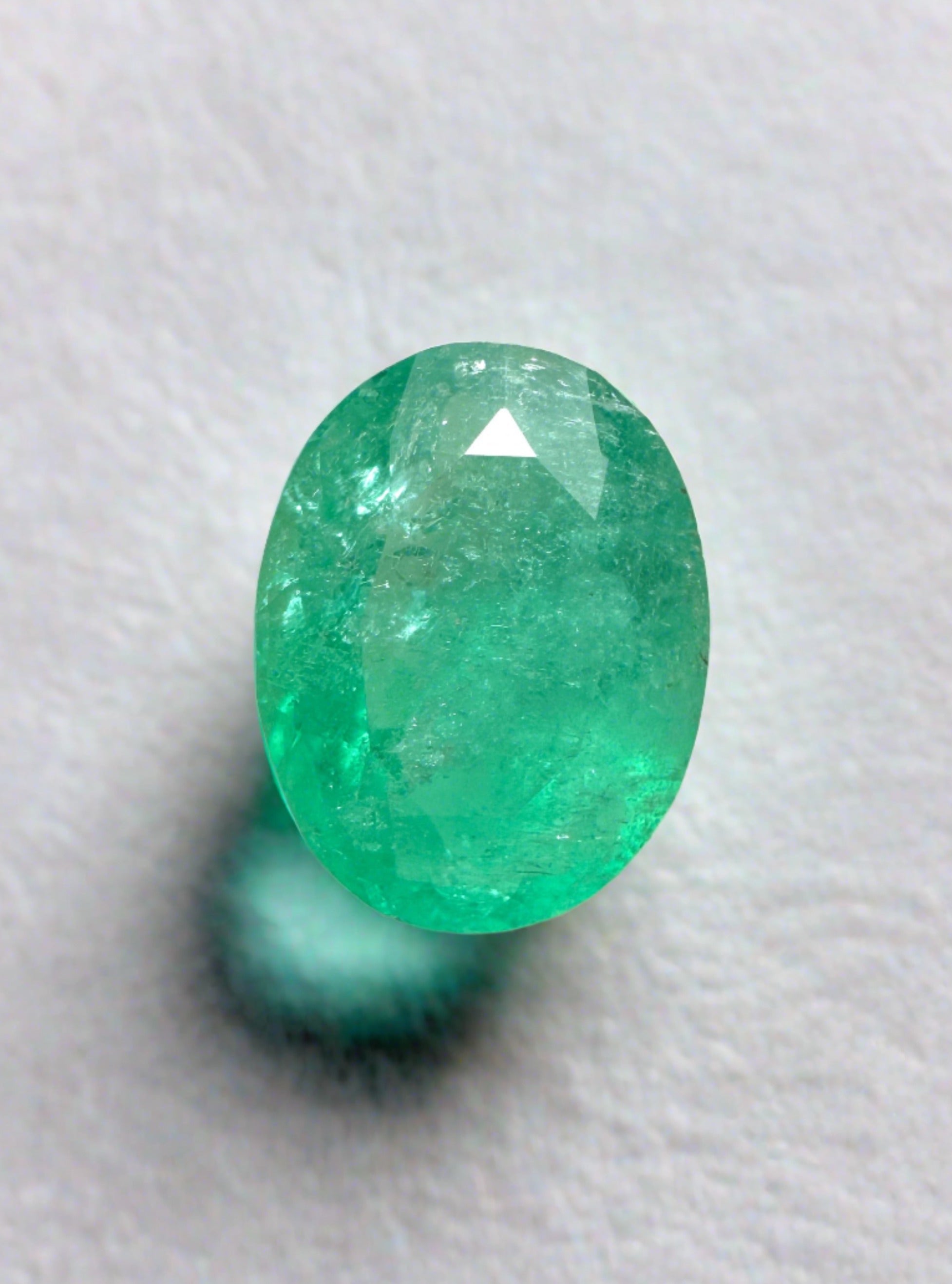 Natural 1.63 carat bluish green Colombian emerald loose oval cut gemstone from JR Colombian Emeralds.