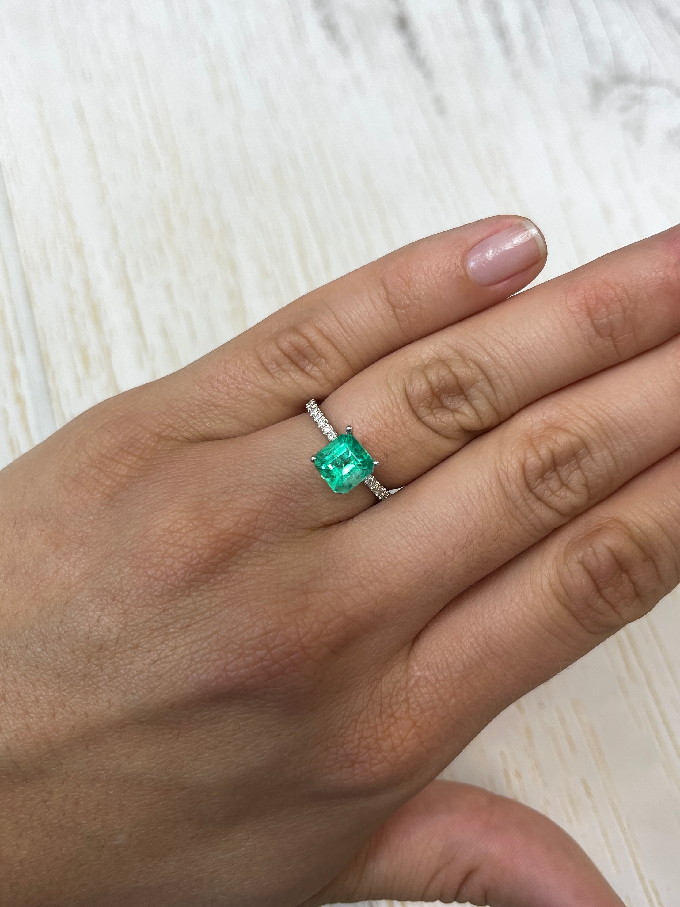 1.64 carat yellowish green Asscher cut Colombian emerald, natural, unset, from JR Colombian Emeralds, showcasing vibrant color and clarity.