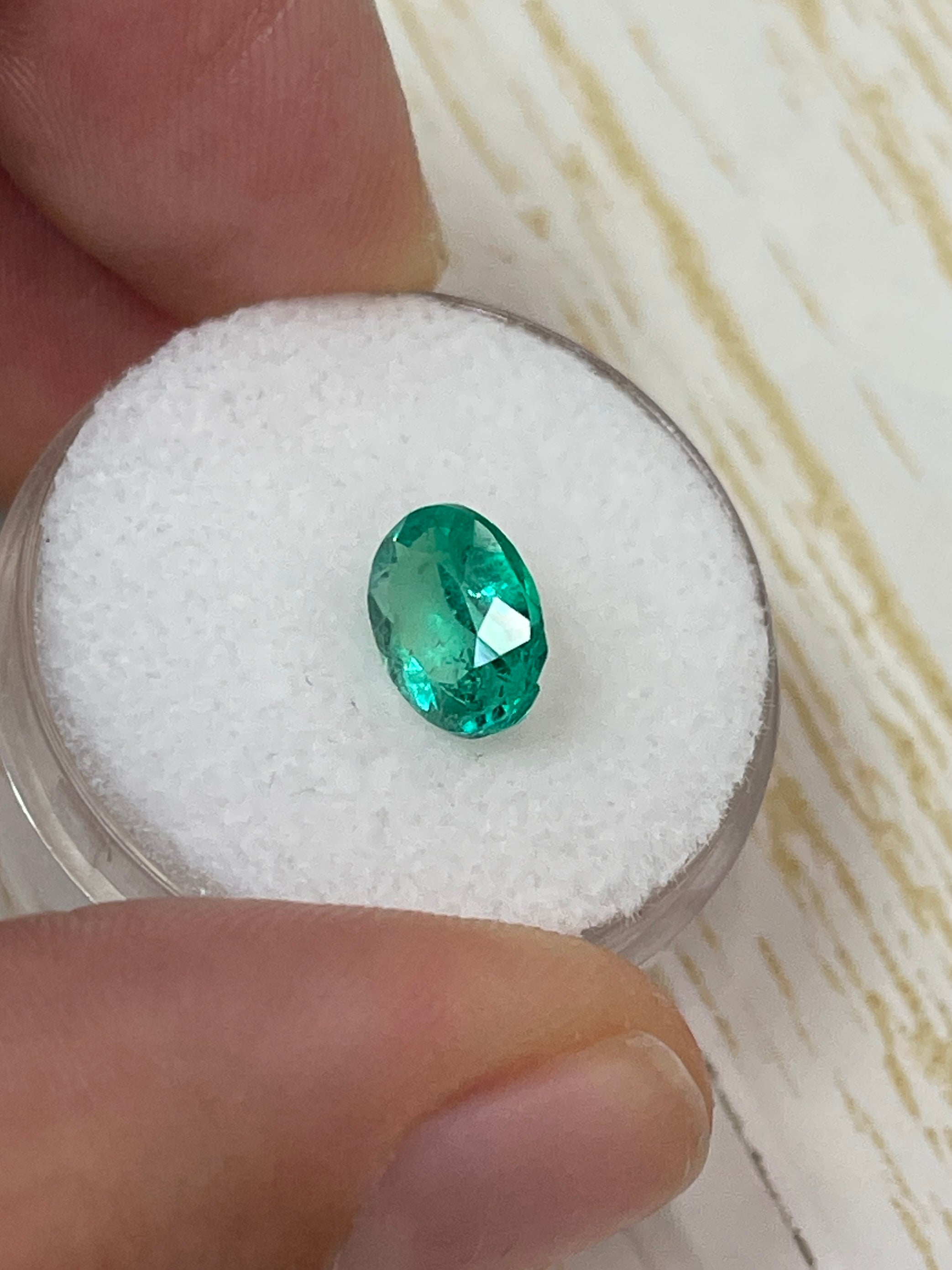 Oval cut 1.64 carat green natural Colombian emerald loose gemstone from JR Colombian Emeralds.
