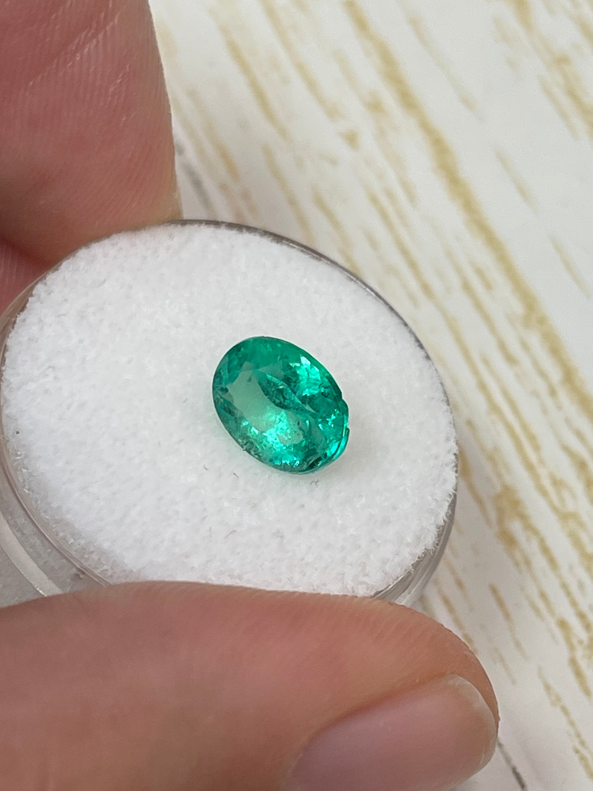 Loose 1.64 Carat oval cut green Colombian emerald from JR Colombian Emeralds, natural and vibrant gemstone.