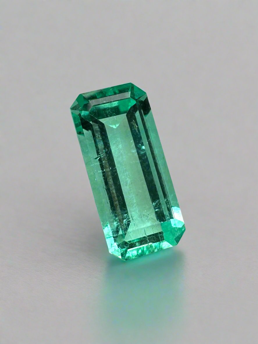 Crystalline 1.65 Carat Colombian Emerald in elongated emerald cut, natural loose gemstone with vibrant green color and clarity
