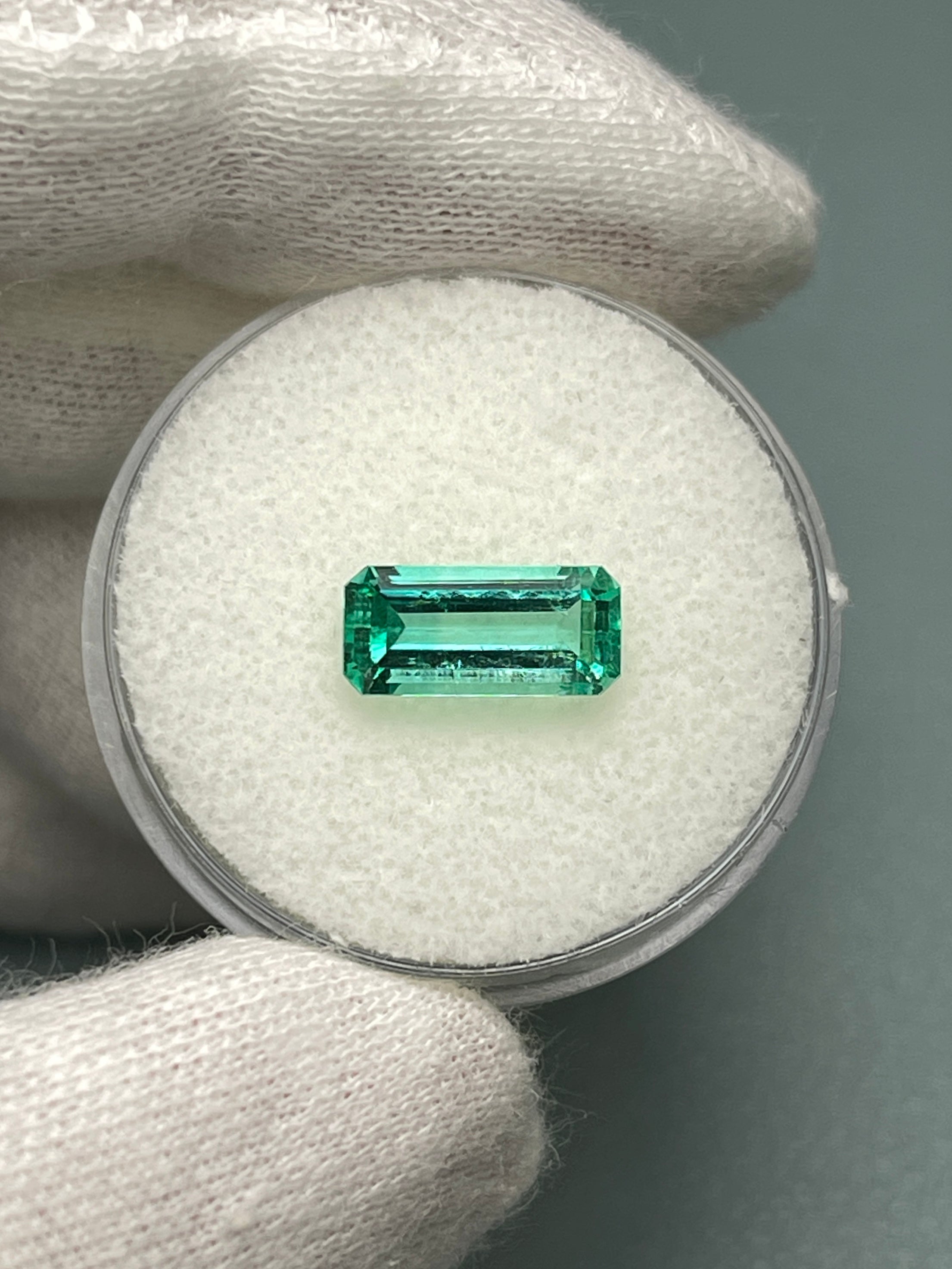 1.65 Carat natural Colombian emerald loose gemstone with elongated emerald cut, crystalline clarity, from JR Colombian Emeralds.