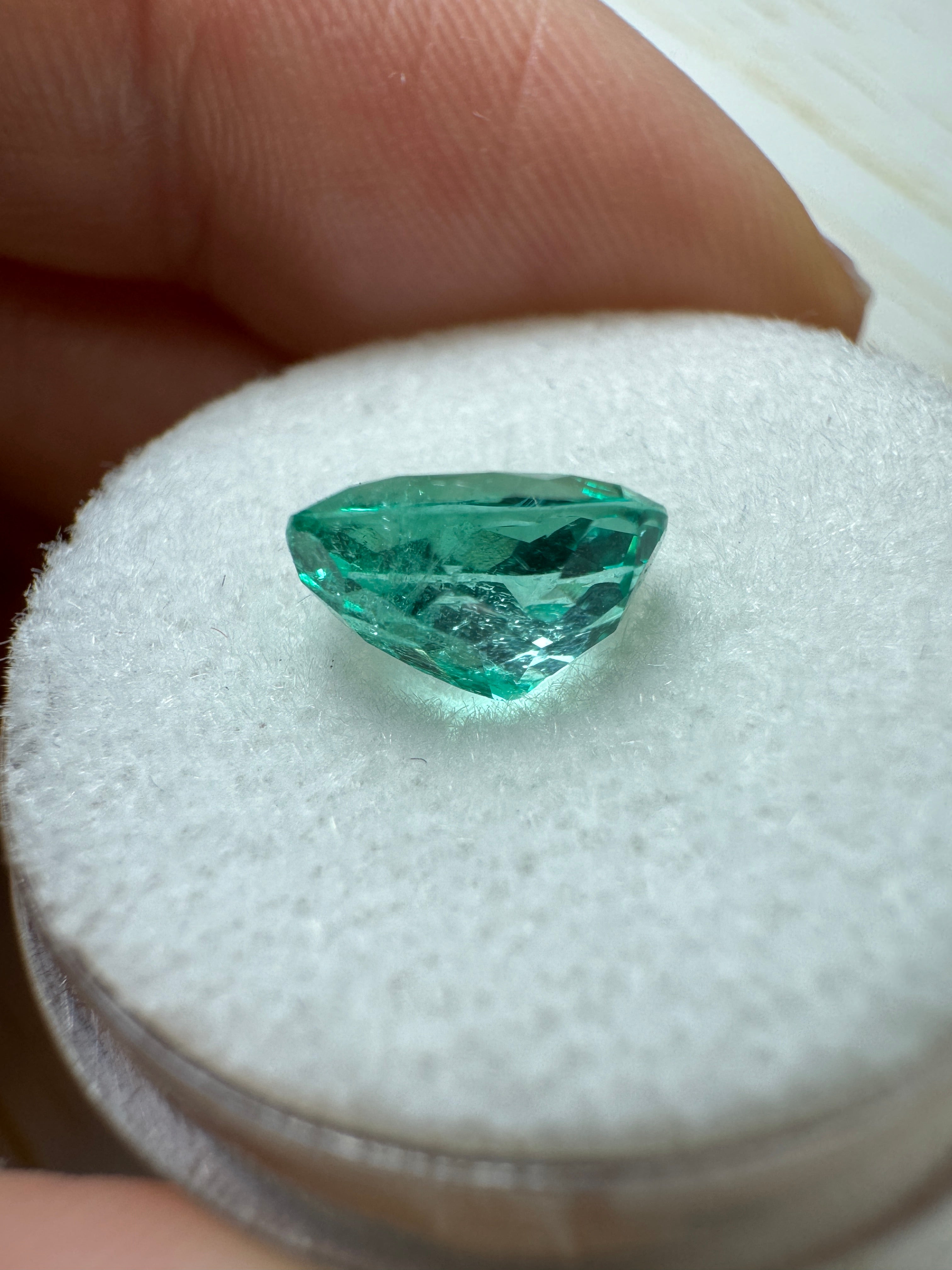 Oval cut 1.72 carat Colombian emerald with crystalline spring green hue, natural loose gemstone from JR Colombian Emeralds.