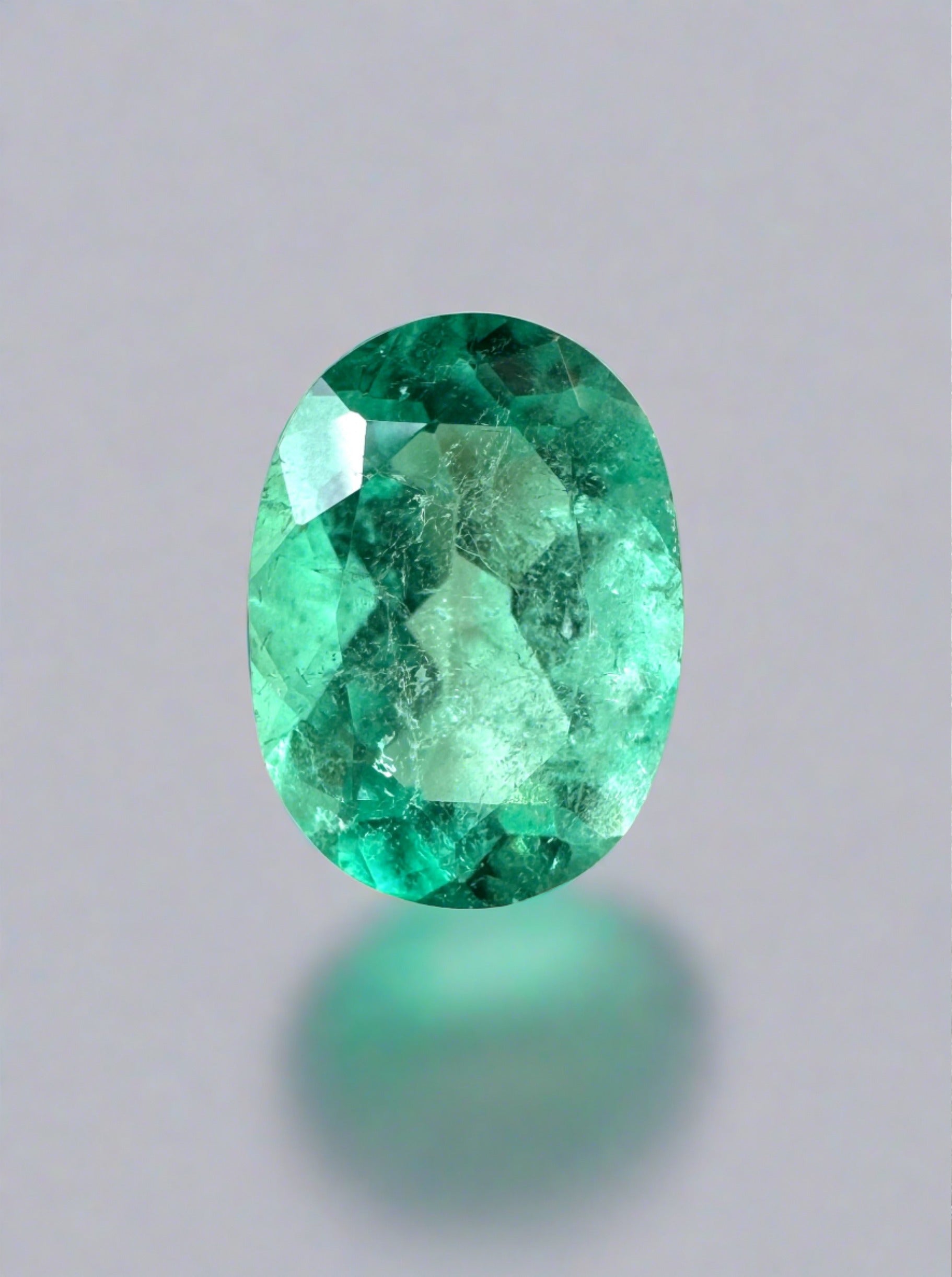 Medium-light green 1.77 carat oval cut Colombian emerald loose gemstone from JR Colombian Emeralds.