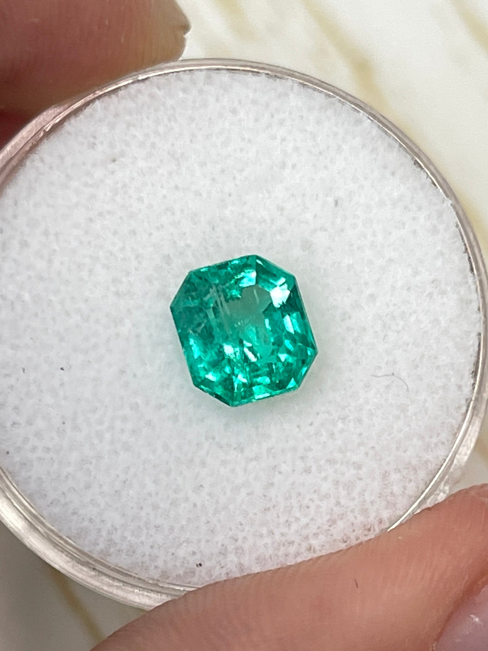 Natural 1.79 carat crystalline green Colombian emerald in Asscher cut, unset and vibrant, from JR Colombian Emeralds.