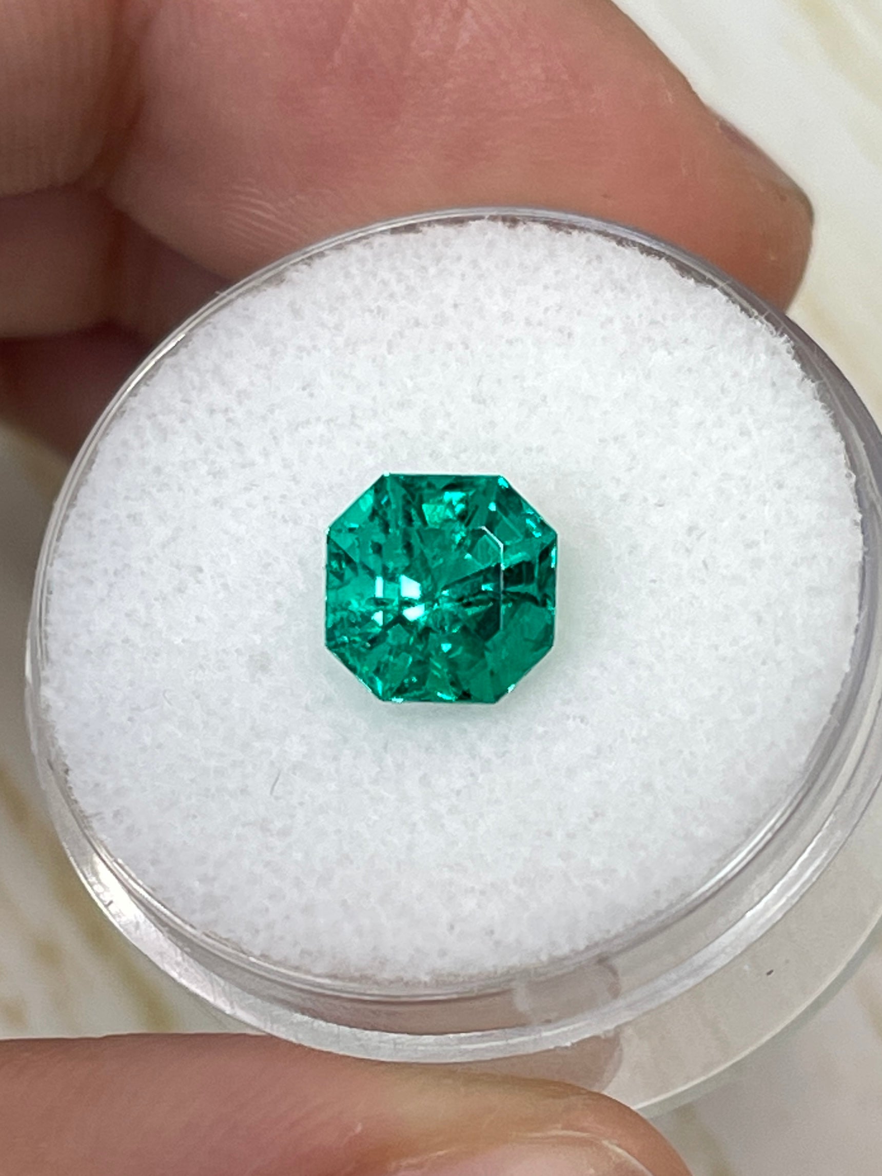 Uncut 1.80 carat AAA+ Muzo Colombian emerald in asscher cut, vibrant green, natural gemstone from JR Colombian Emeralds.