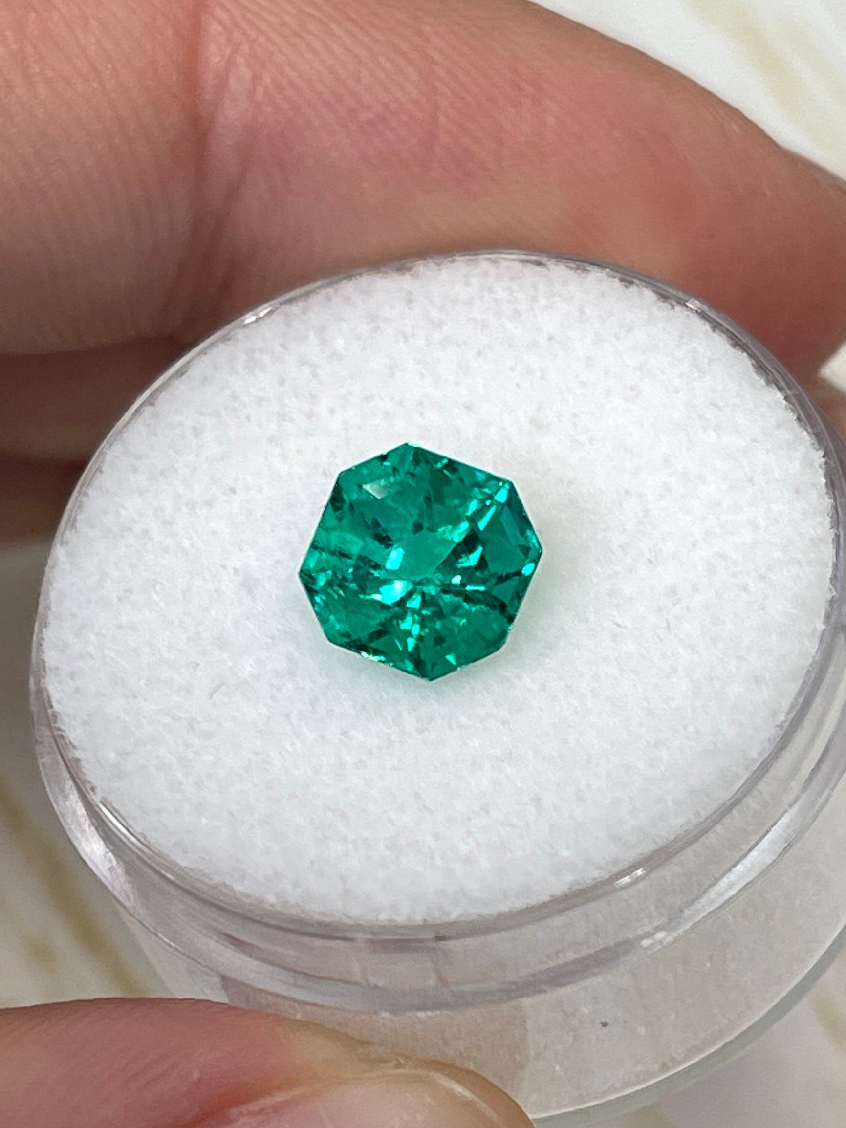 Uncut 1.80 carat AAA+ Muzo Colombian green emerald in Asscher cut, natural and unset, from JR Colombian Emeralds.