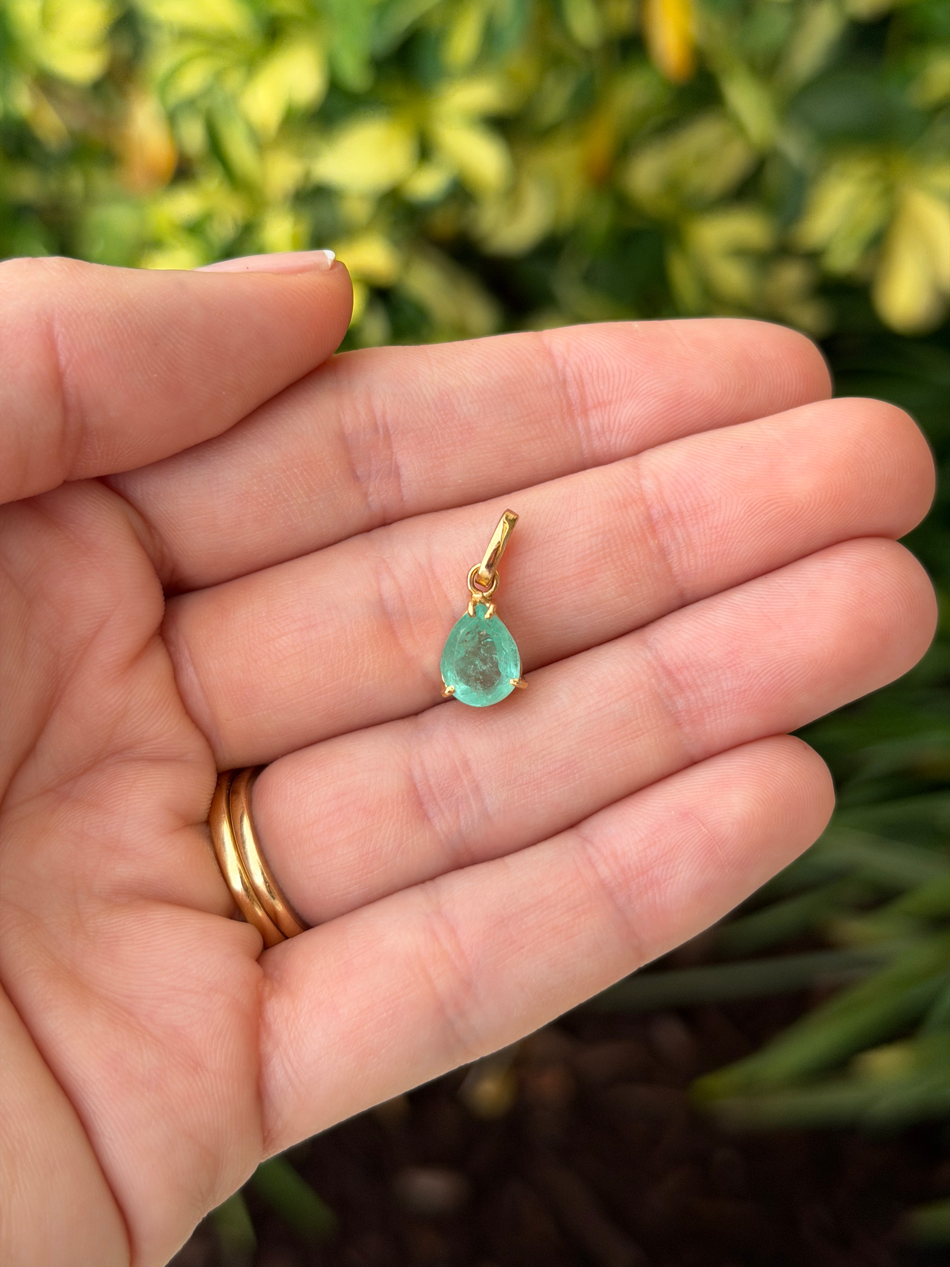 Light green Colombian emerald pear cut solitaire necklace featuring a 1.80 carat emerald by JR Colombian Emeralds.