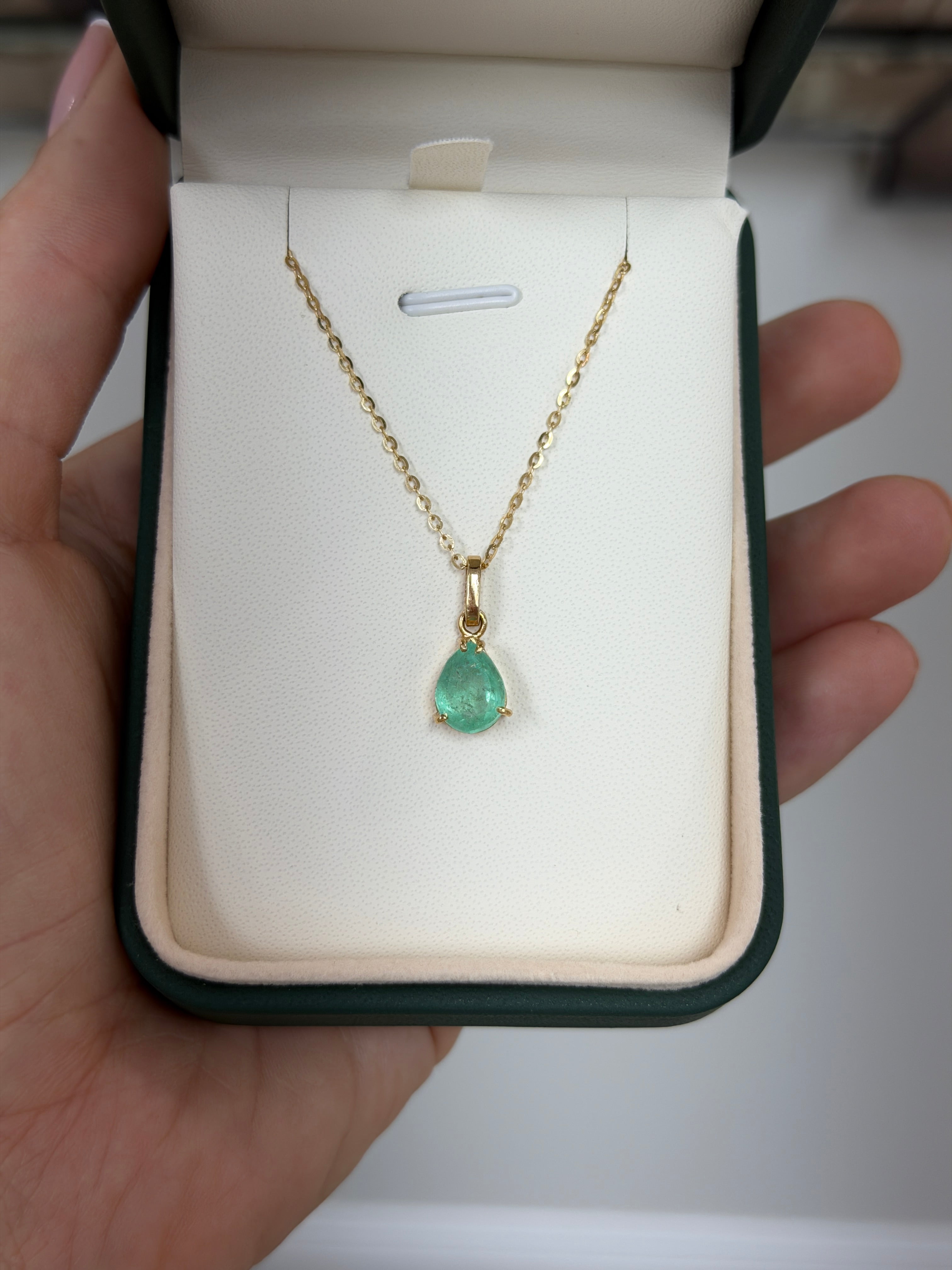 Light green Colombian emerald solitaire necklace featuring a 1.80 carat pear-shaped emerald by JR Colombian Emeralds.