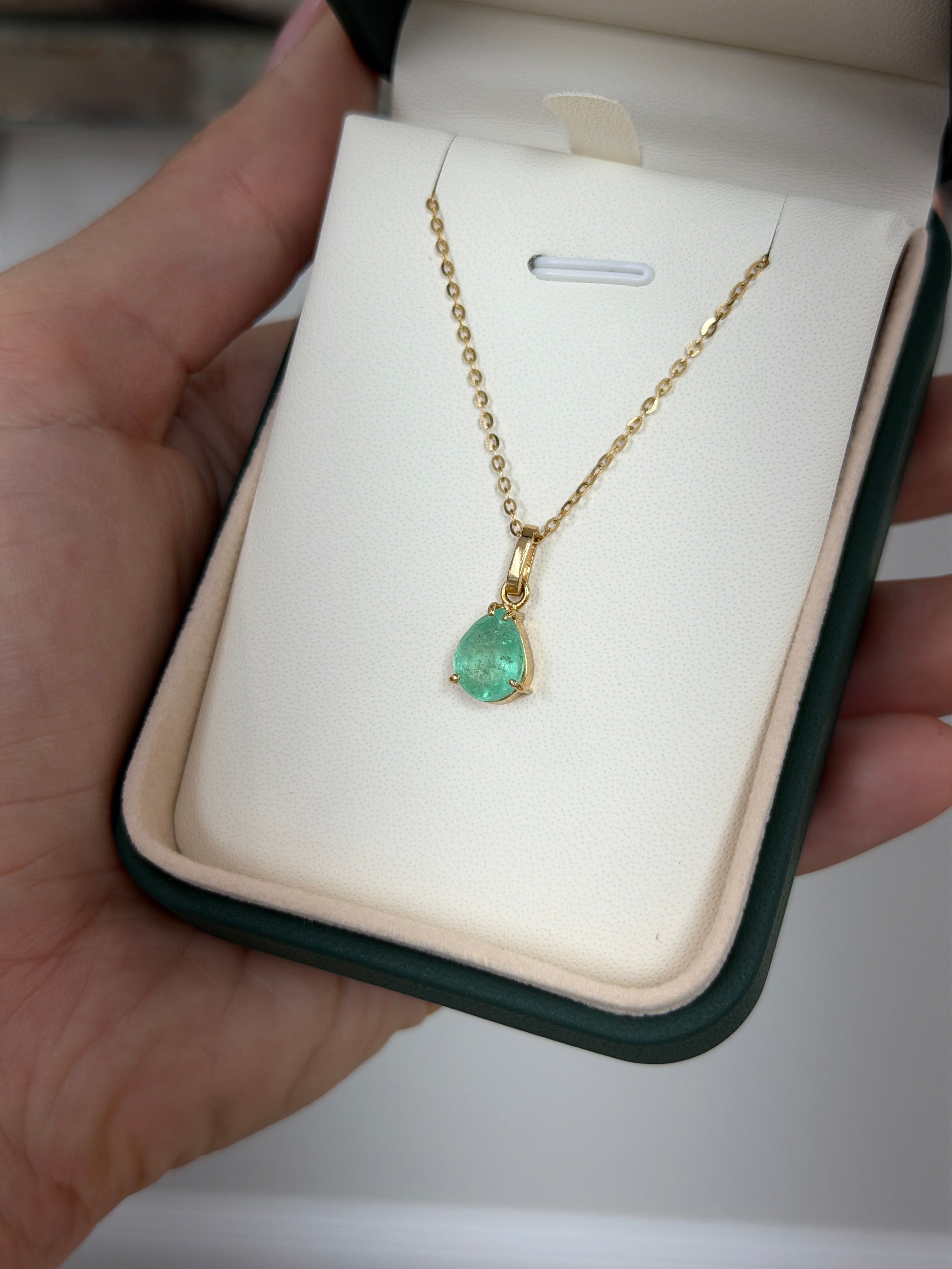 Light green Colombian emerald solitaire necklace with 1.80 carat pear cut gem by JR Colombian Emeralds.