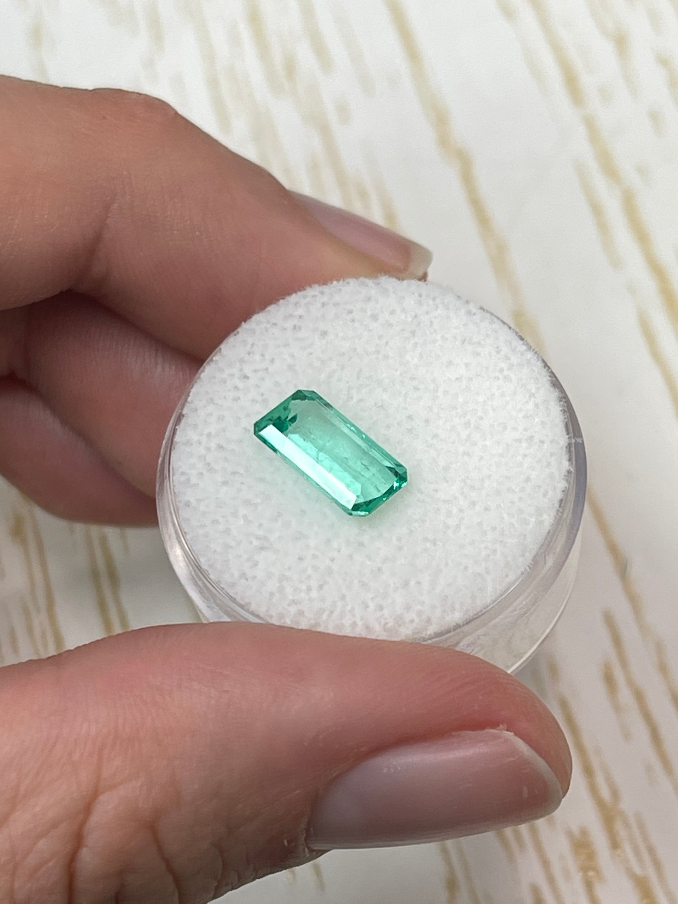 Loose 1.80 carat VVS Colombian emerald, 10x6mm slender emerald cut, bluish green color, from JR Colombian Emeralds.