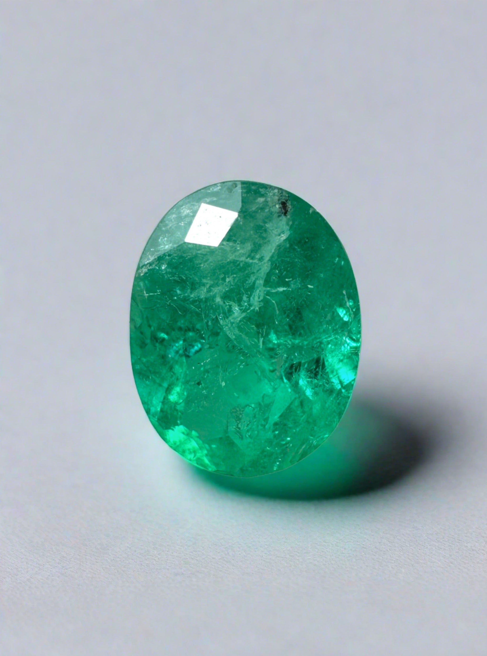 Oval cut 1.87 carat medium green natural Colombian emerald loose gemstone from JR Colombian Emeralds.
