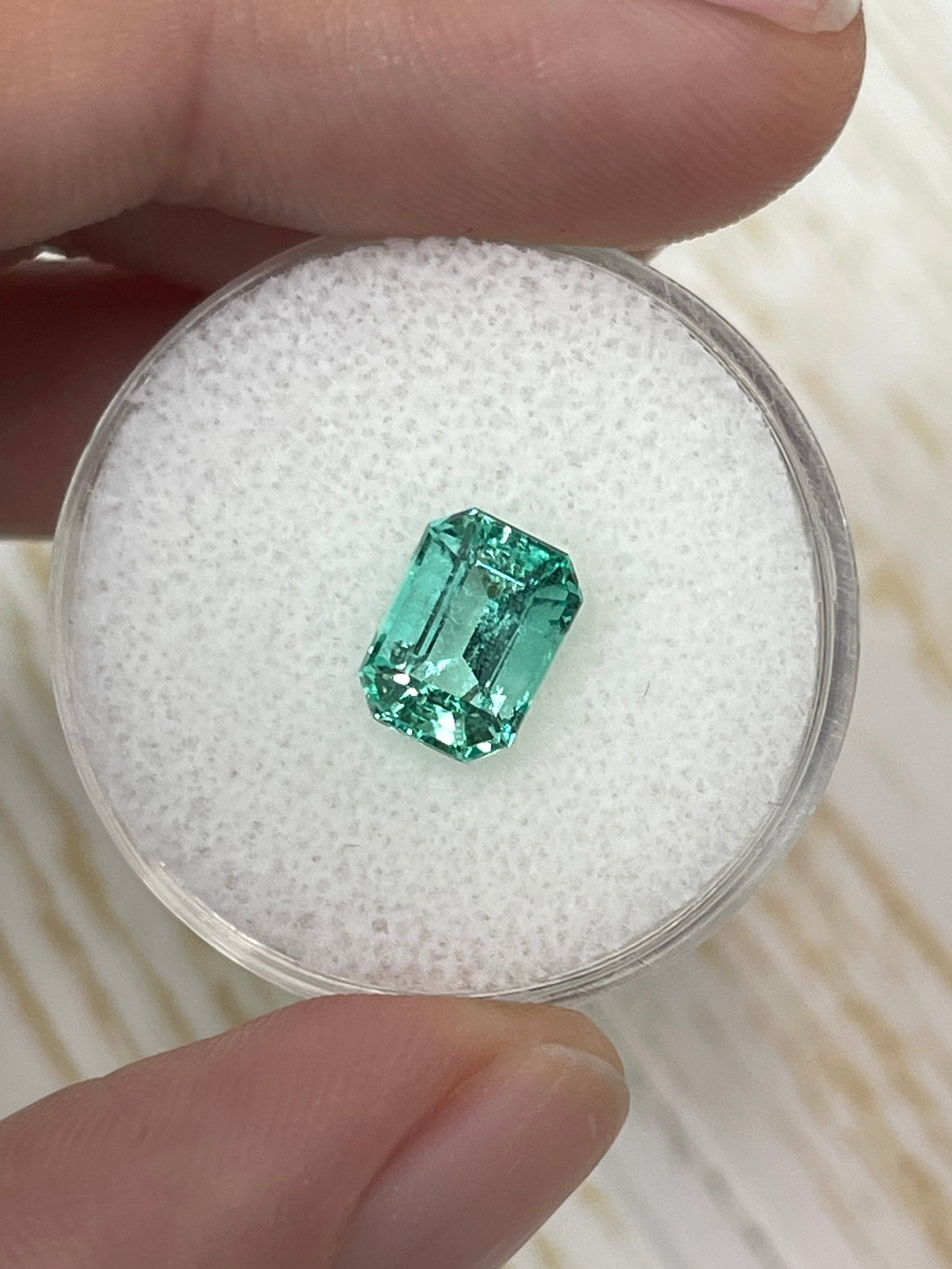 1.91 carat green Colombian emerald loose gemstone in an emerald cut, showcasing its natural color and clarity from JR Colombian Emeralds.