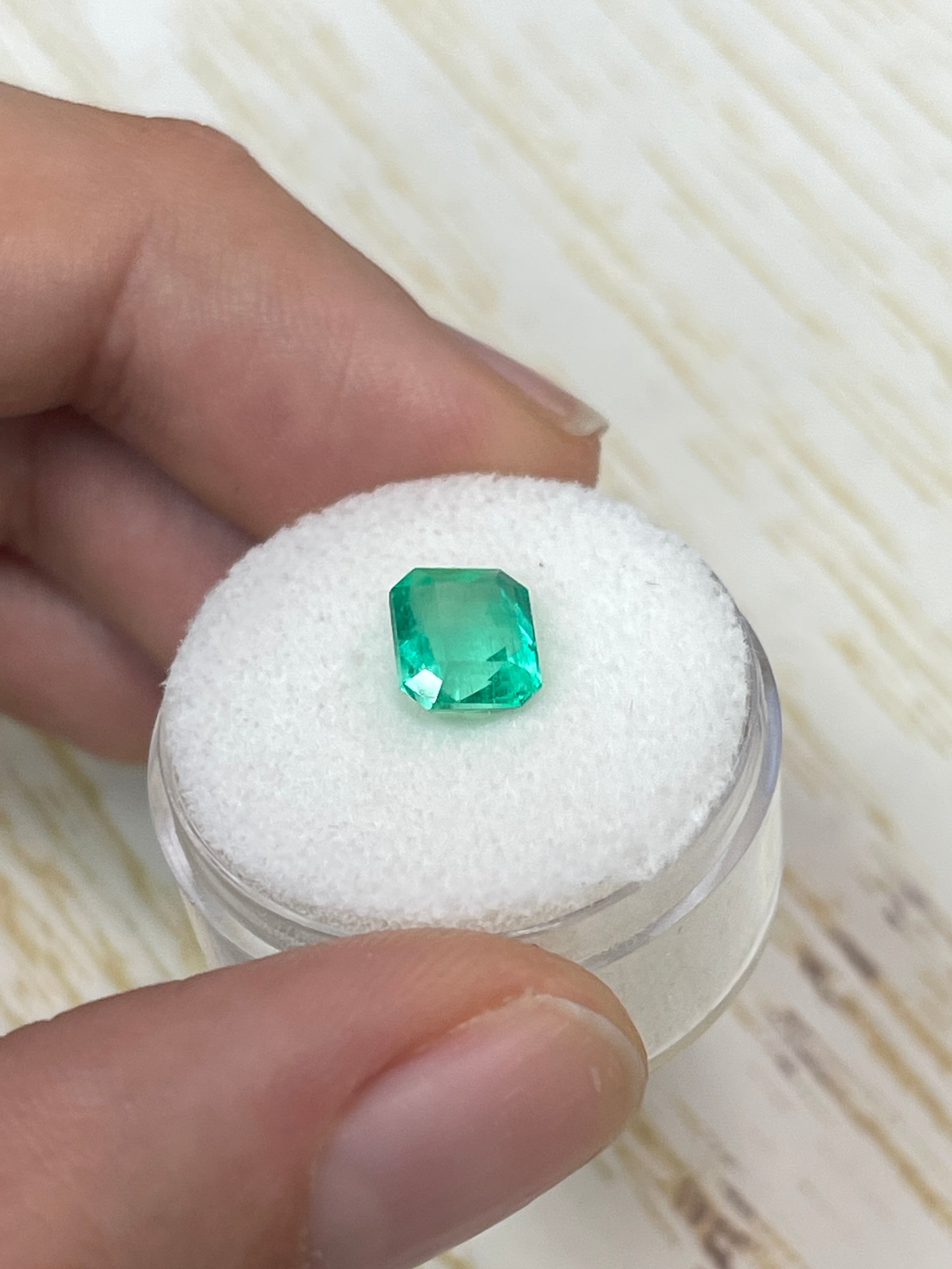 1.92 carat vivacious Muzo green Colombian emerald loose gemstone, 8x7 mm emerald cut, from JR Colombian Emeralds.