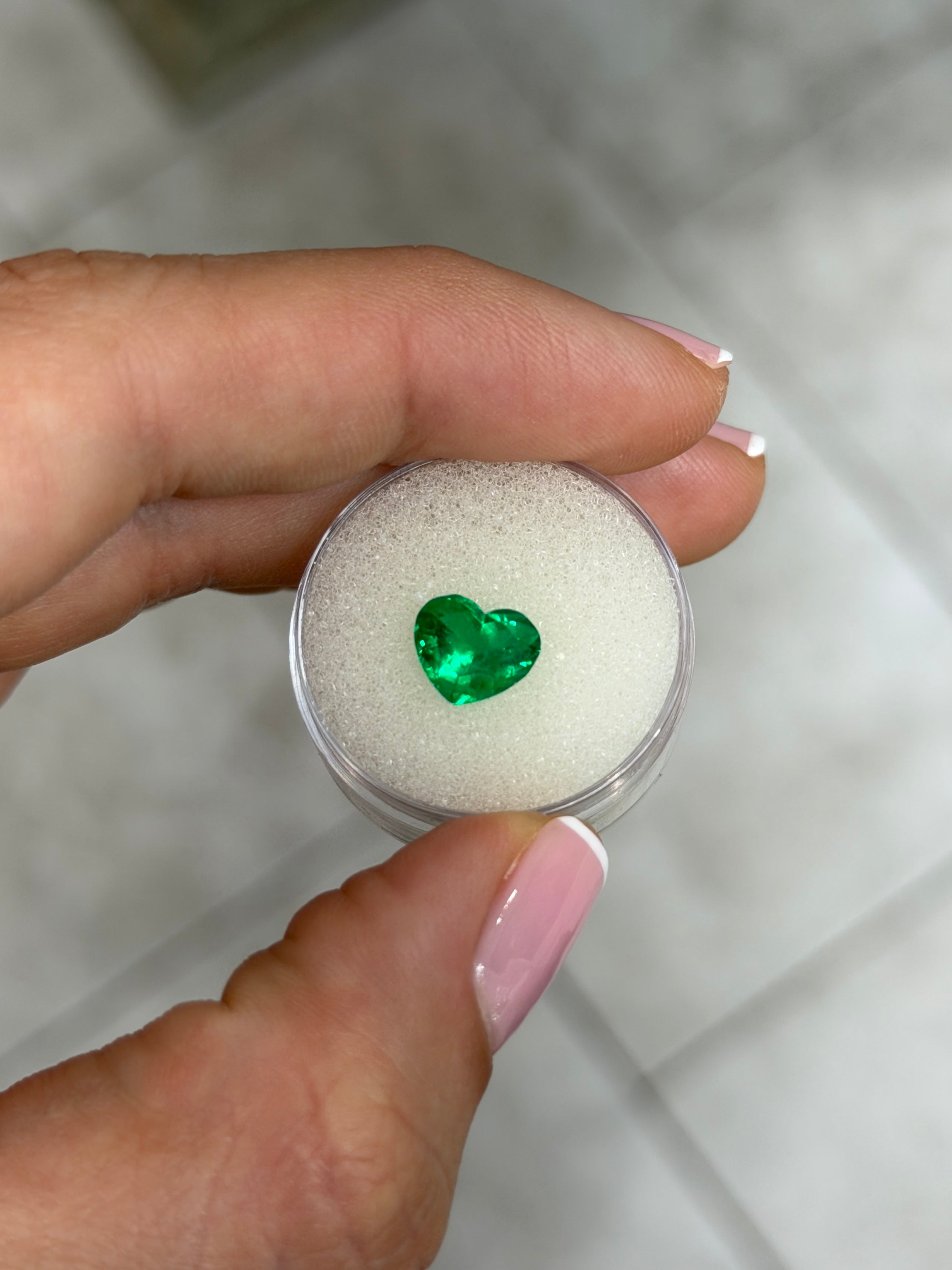 1.94 carat AAA+ Vivid Intense Muzo green Colombian emerald loose heart cut gemstone, natural and vibrant.