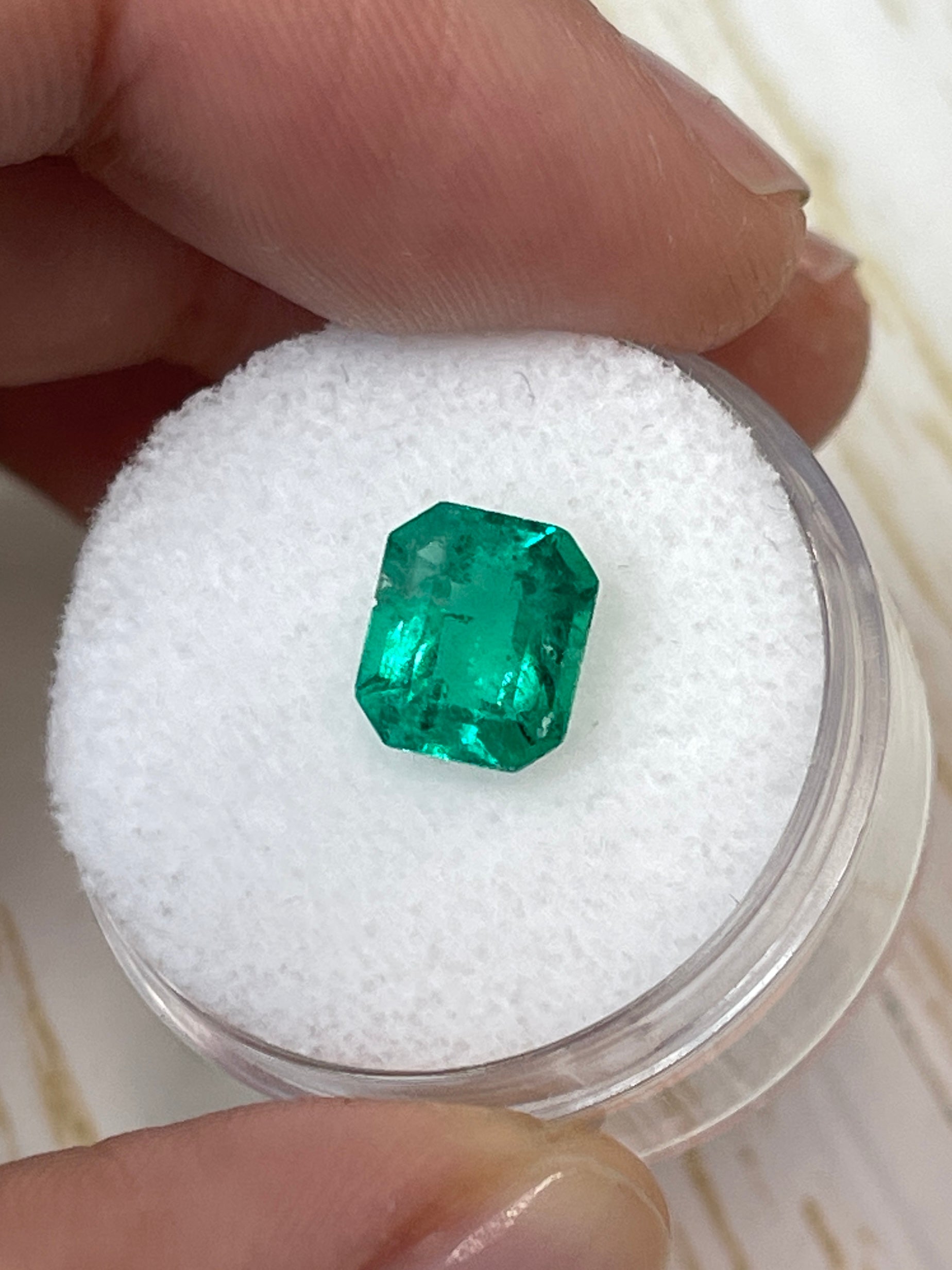 Freckled 1.94 Carat green Colombian emerald loose gemstone in emerald cut, size 8.5x7, natural and vibrant from JR Colombian Emeralds