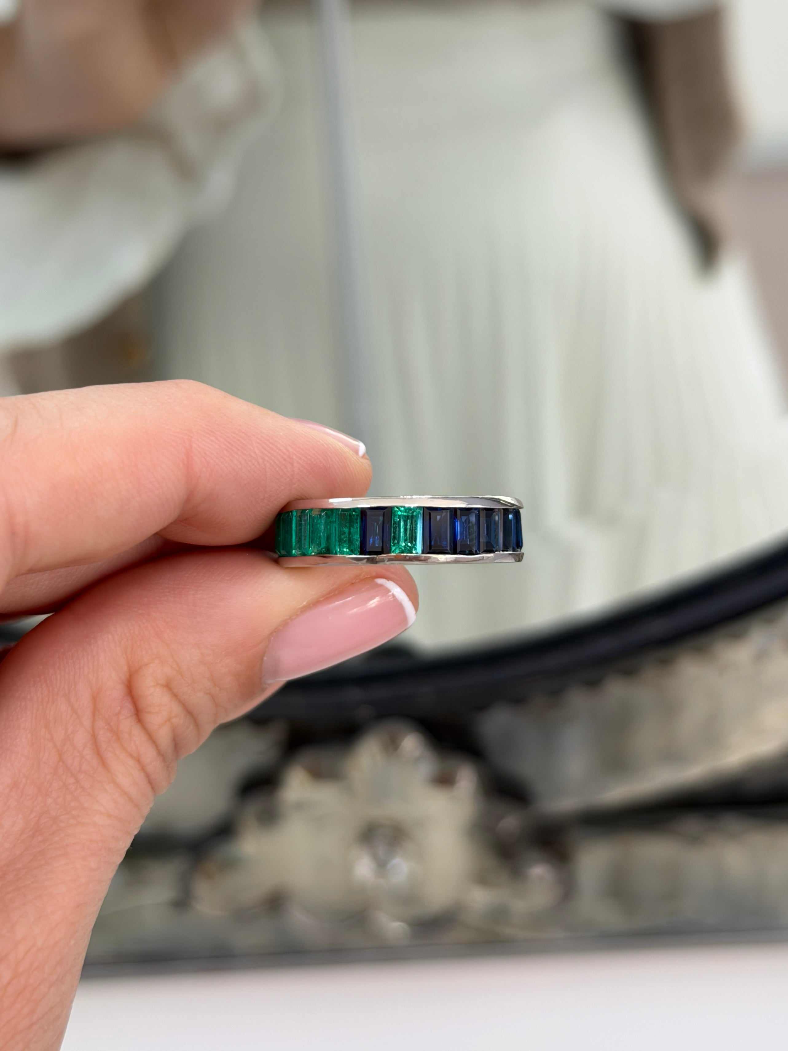 Platinum eternity band with 10.05tcw Colombian emeralds and blue sapphires in baguette cut, size 7, by JR Colombian Emeralds.