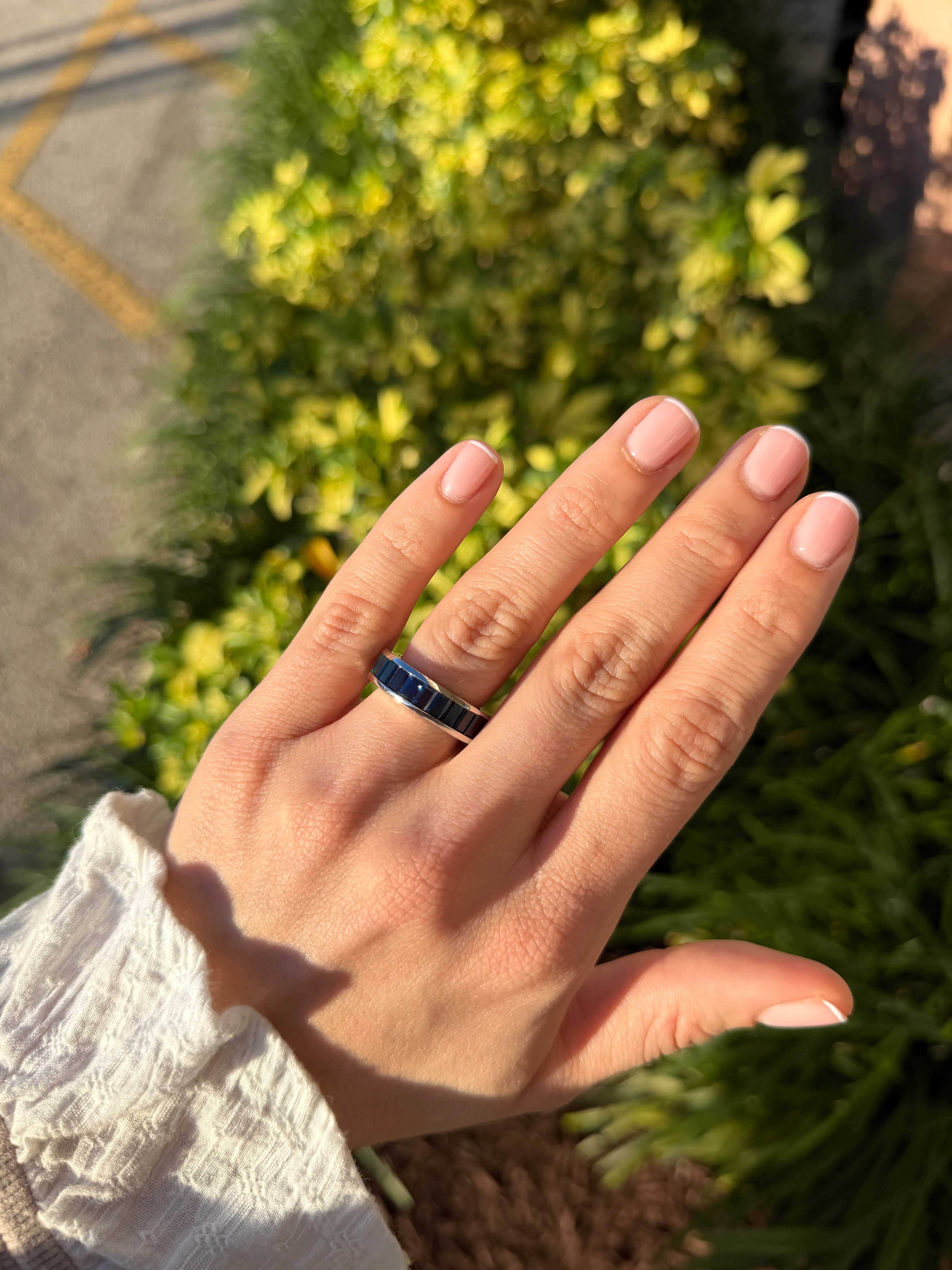 Platinum eternity band with 10.05tcw AAA+ Colombian emeralds and blue sapphires, size 7, channel set by JR Colombian Emeralds.