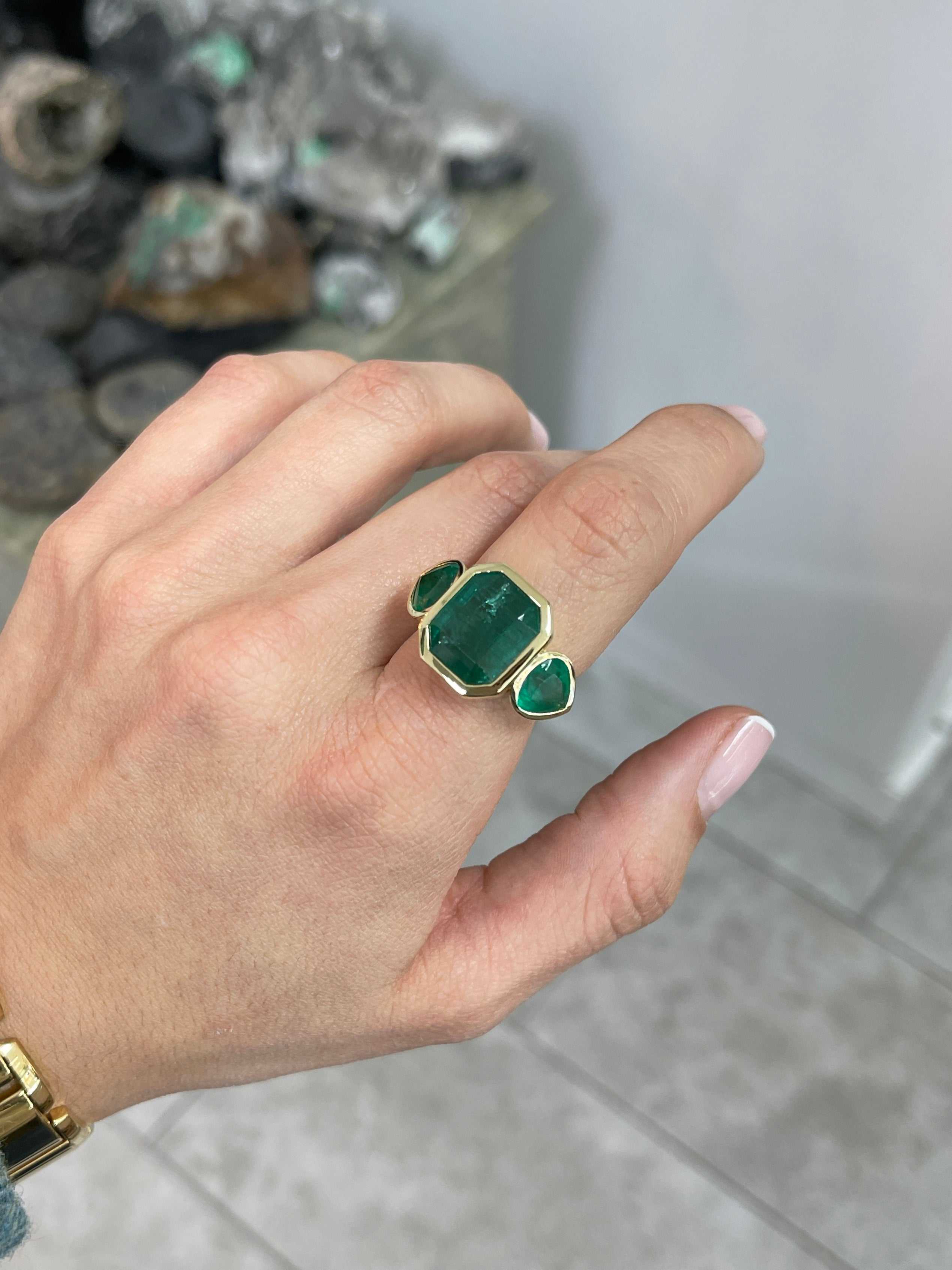 15.44tcw Emerald Cut Emerald and Pear Accents 3 Stone Bezel Ring 18K Gold