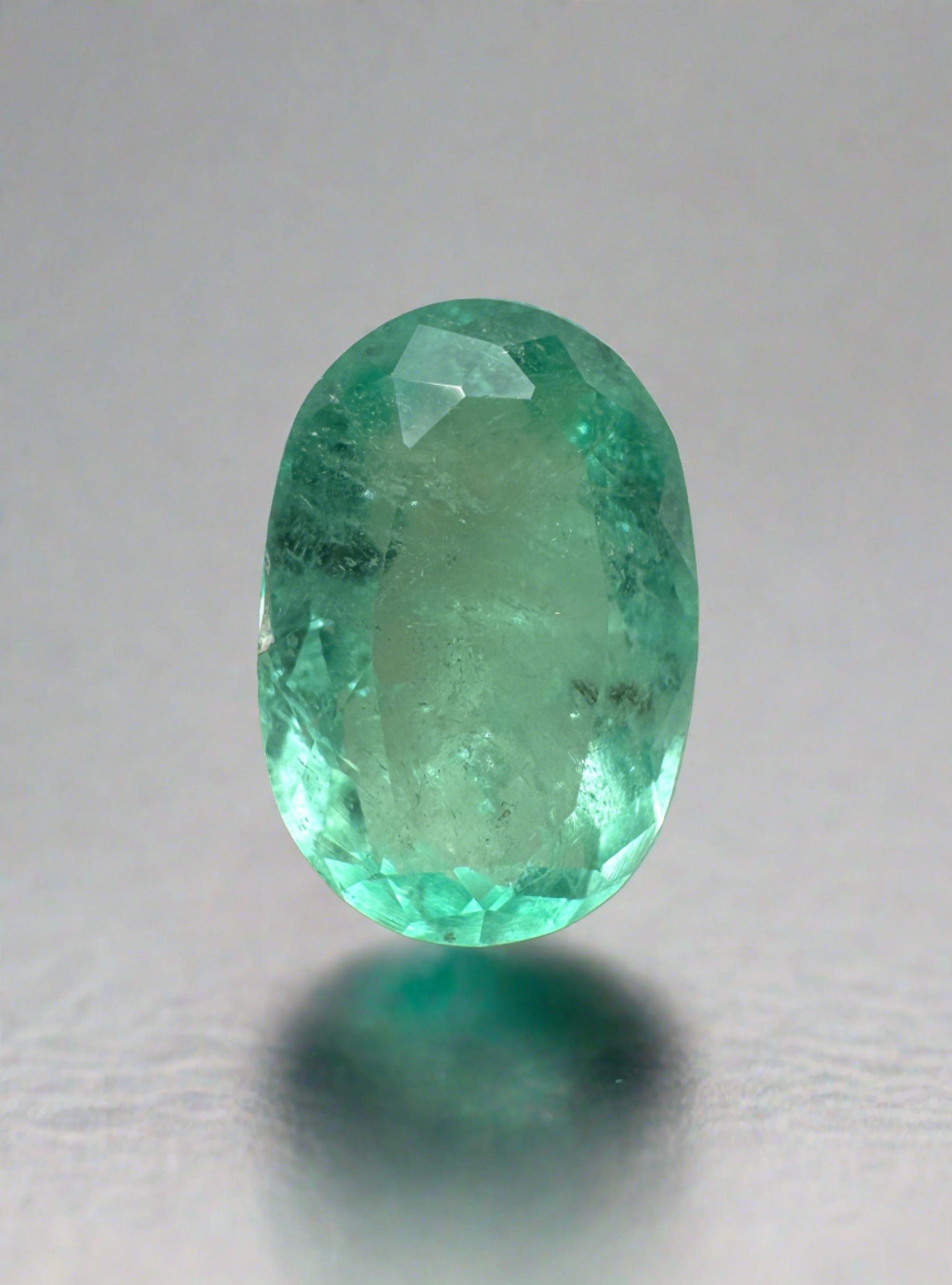 Light bluish green 2.22 carat oval cut Colombian emerald, natural loose gemstone from JR Colombian Emeralds.