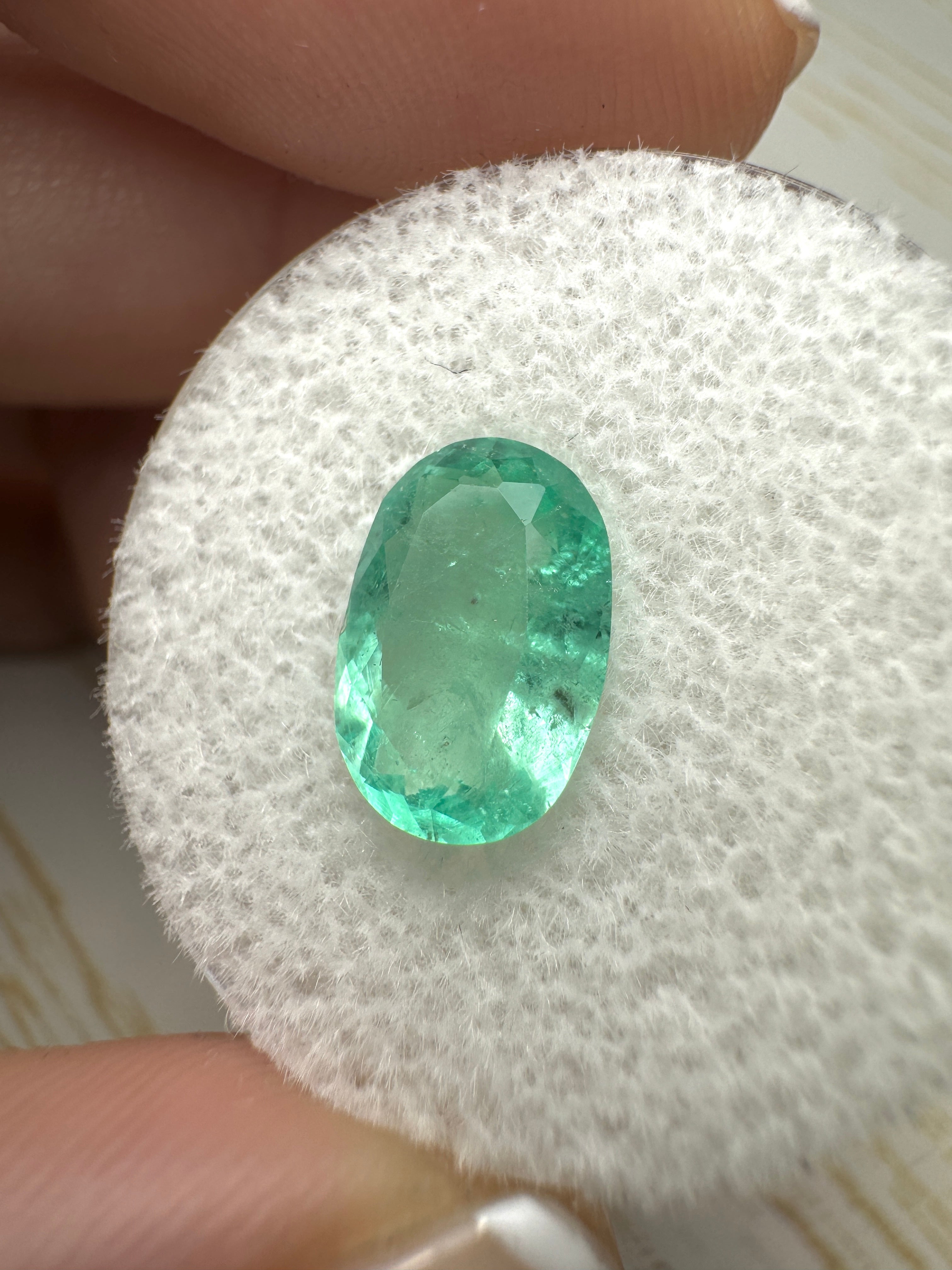 Light bluish green 2.22 carat natural Colombian emerald in oval cut, loose gemstone from JR Colombian Emeralds.