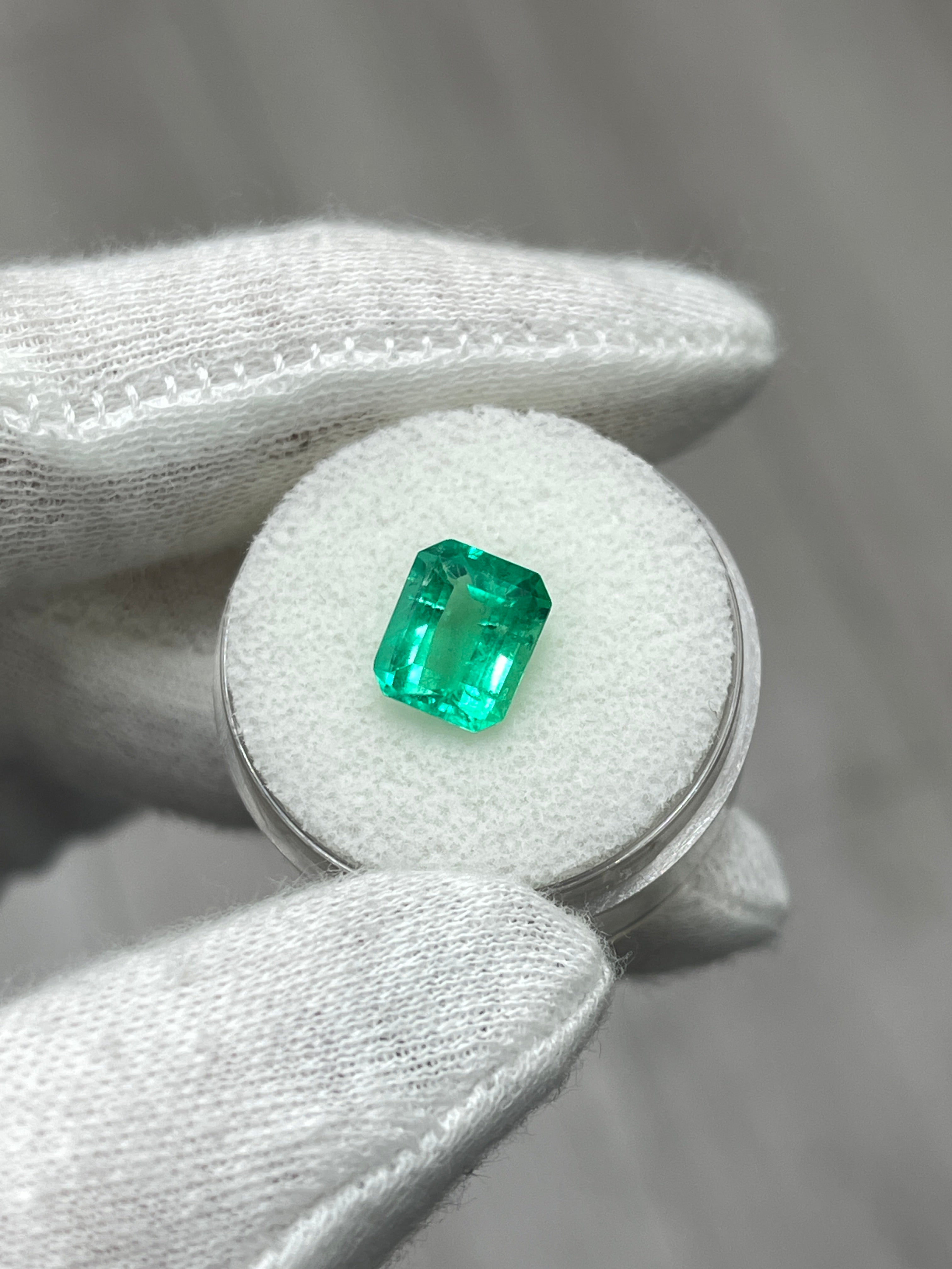 2.27 Carat Muzo medium green Colombian emerald loose gemstone in emerald cut, natural and vibrant green from JR Colombian Emeralds