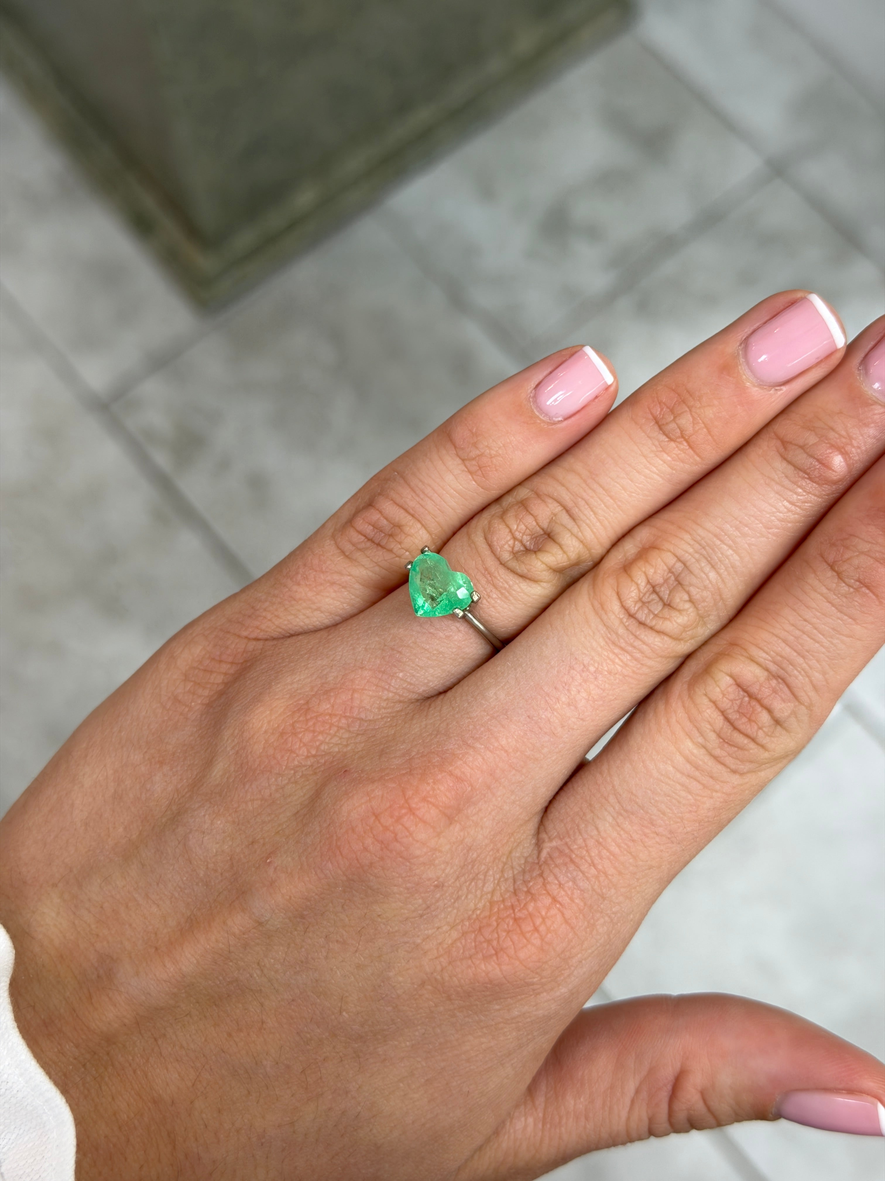 Yellowish green 2.30 carat Colombian emerald loose gemstone in heart cut, from JR Colombian Emeralds, natural and vibrant.