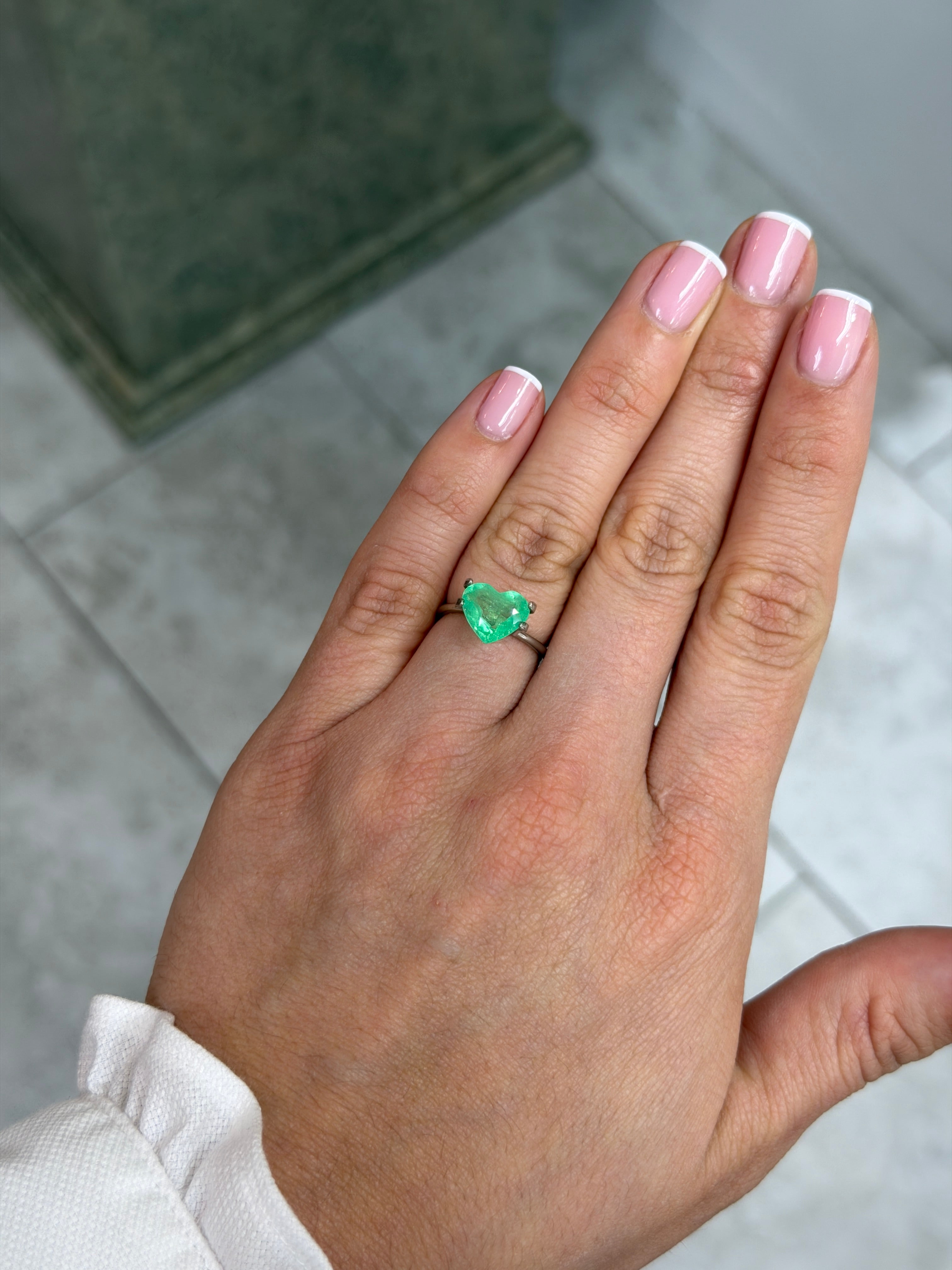 Yellowish green 2.30 carat natural Colombian emerald loose gemstone in heart cut, 8.5x10mm, from JR Colombian Emeralds.