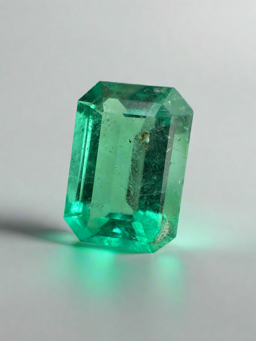 Medium green Colombian emerald cut gemstone, 2.31 carats, freckled surface, from JR Colombian Emeralds.