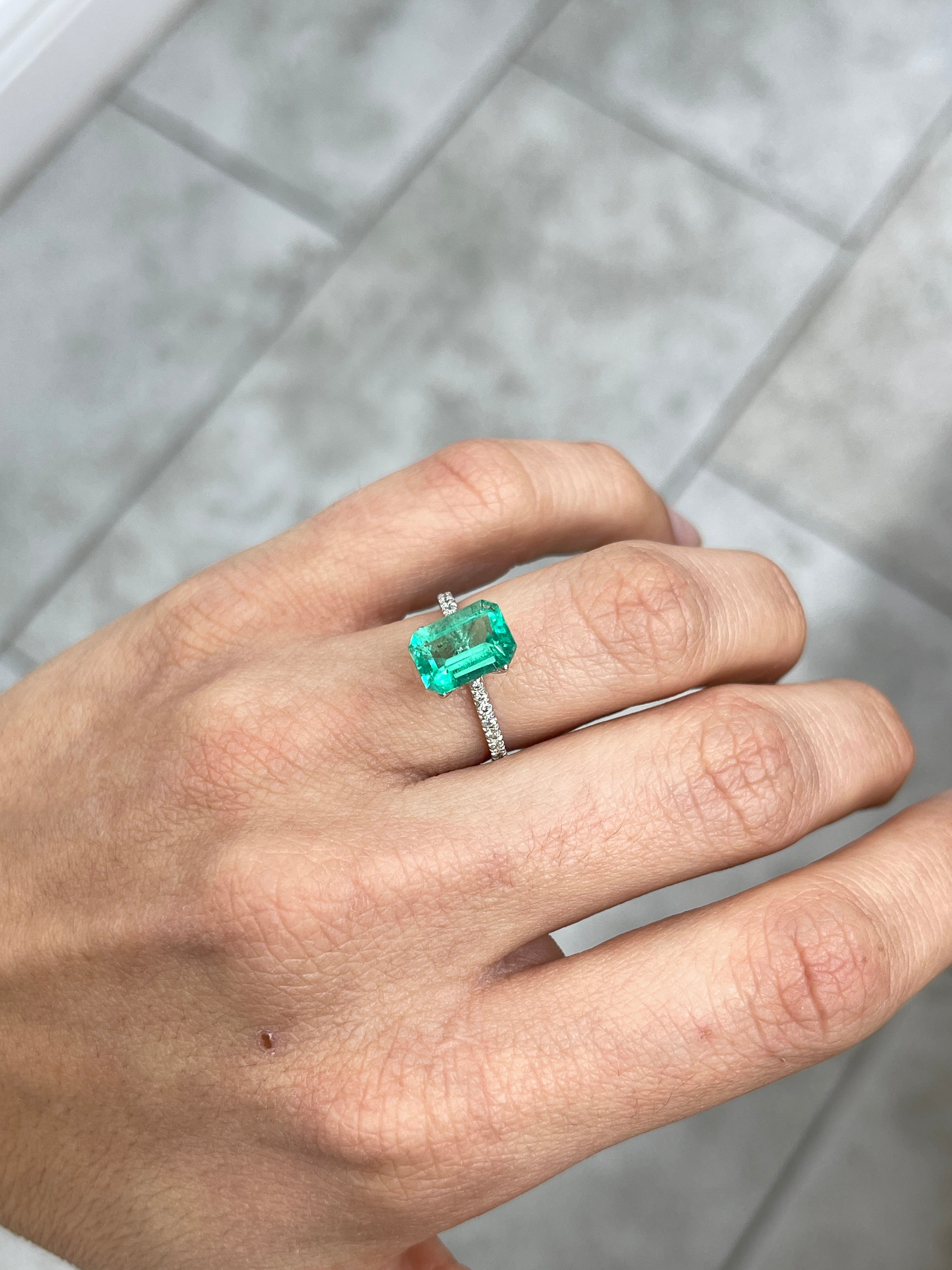 Medium green Colombian emerald cut with natural freckles, 2.31 carats, 10x7mm from JR Colombian Emeralds.