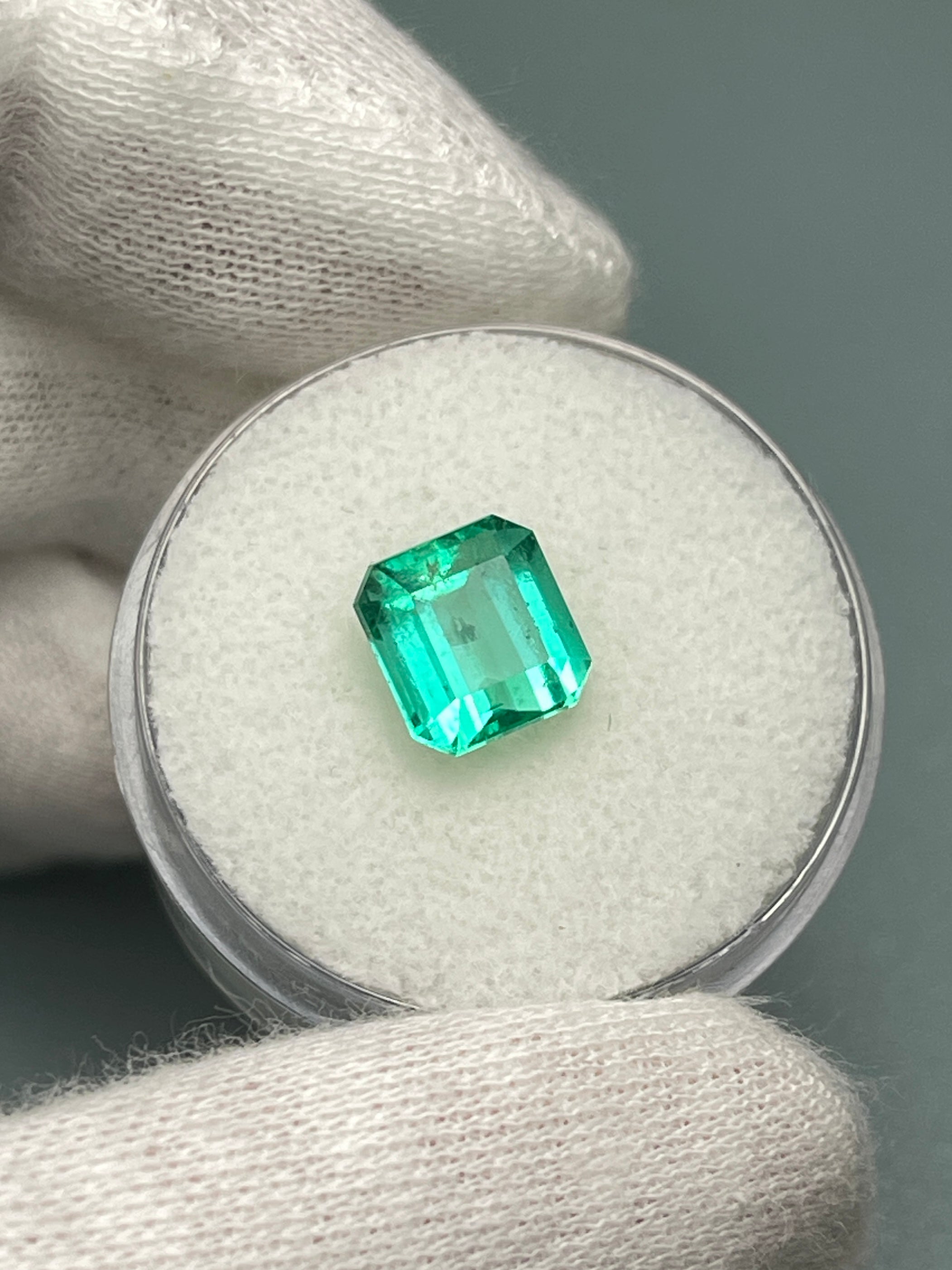 2.36-carat natural Colombian emerald loose gemstone in Asscher cut, showcasing vibrant green color and clarity.