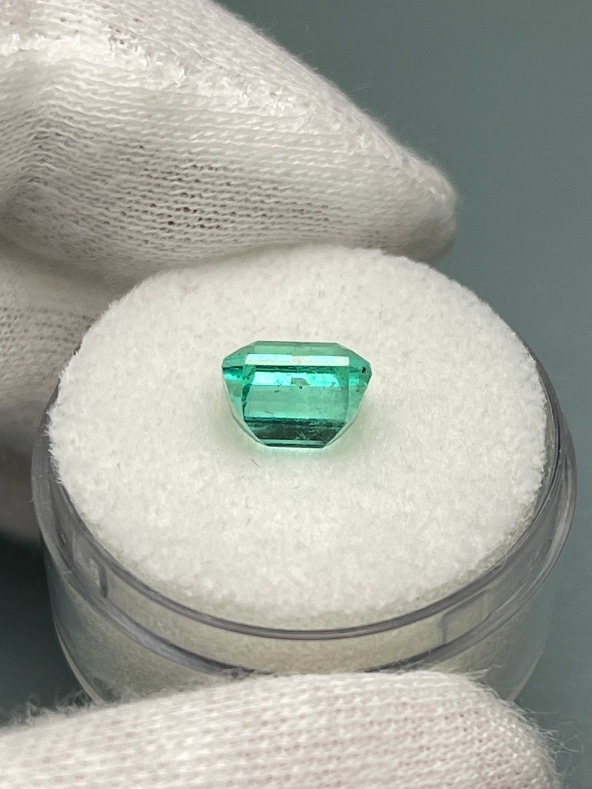2.36 carat natural loose Colombian emerald in Asscher cut, showing vibrant green color and clarity from JR Colombian Emeralds