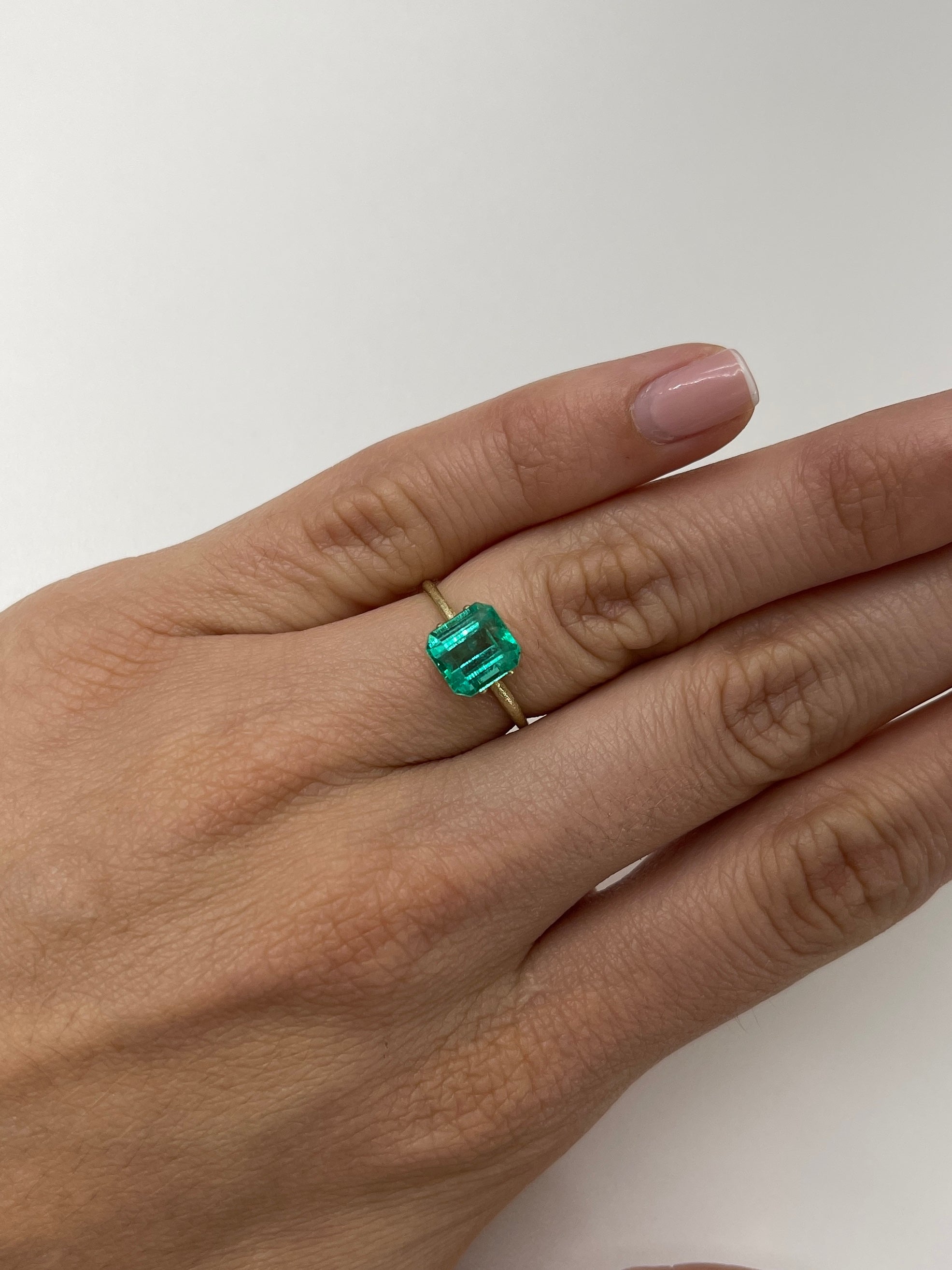 2.36 carat natural Colombian emerald loose gemstone, Asscher cut, from JR Colombian Emeralds, showcasing vibrant green color and clarity.