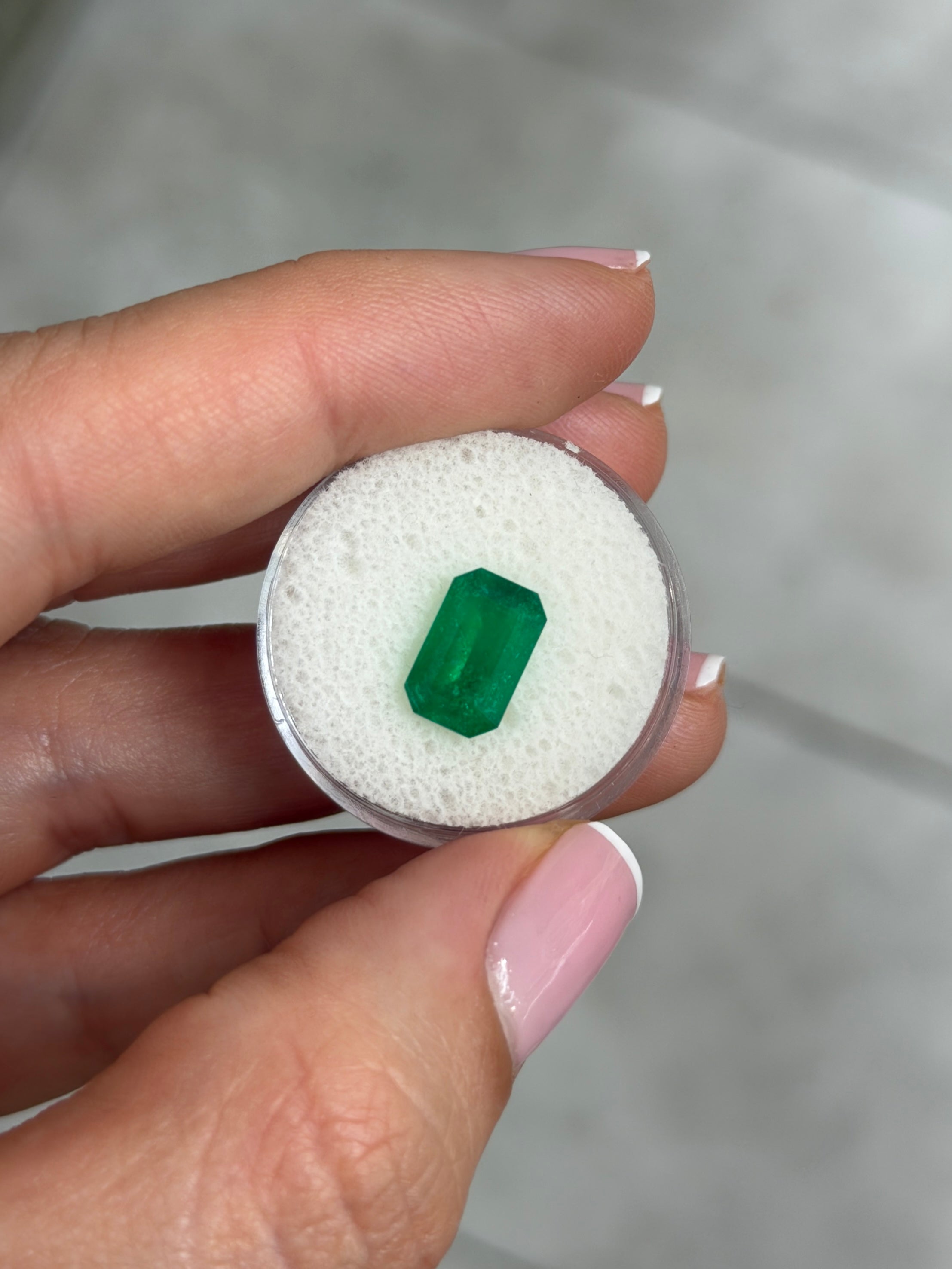 Deep jungle green 2.40 carat natural Colombian emerald in elongated emerald cut, loose gemstone by JR Colombian Emeralds.